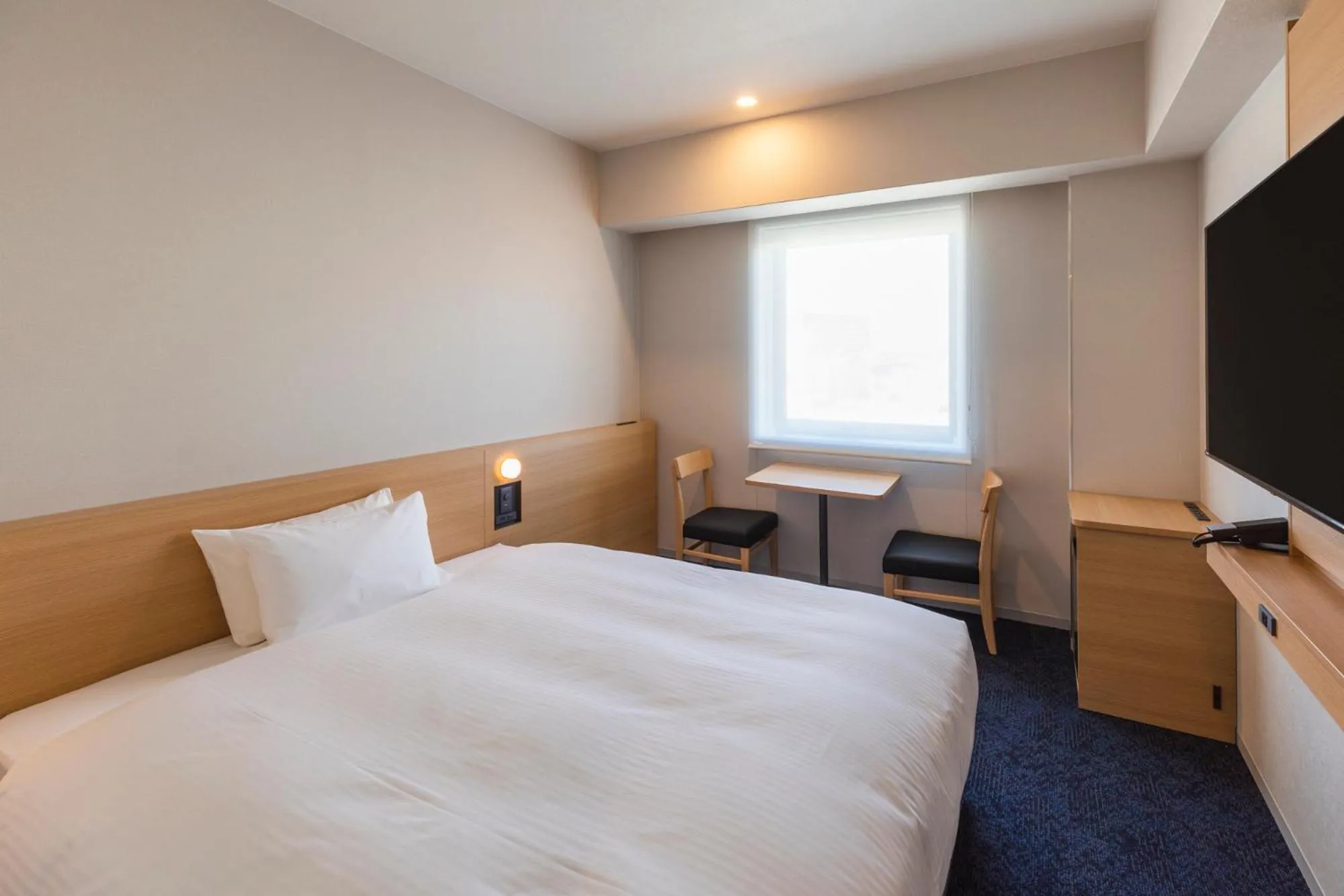 Photo of the whole room, Bed in Sotetsu Grand Fresa Kumamoto