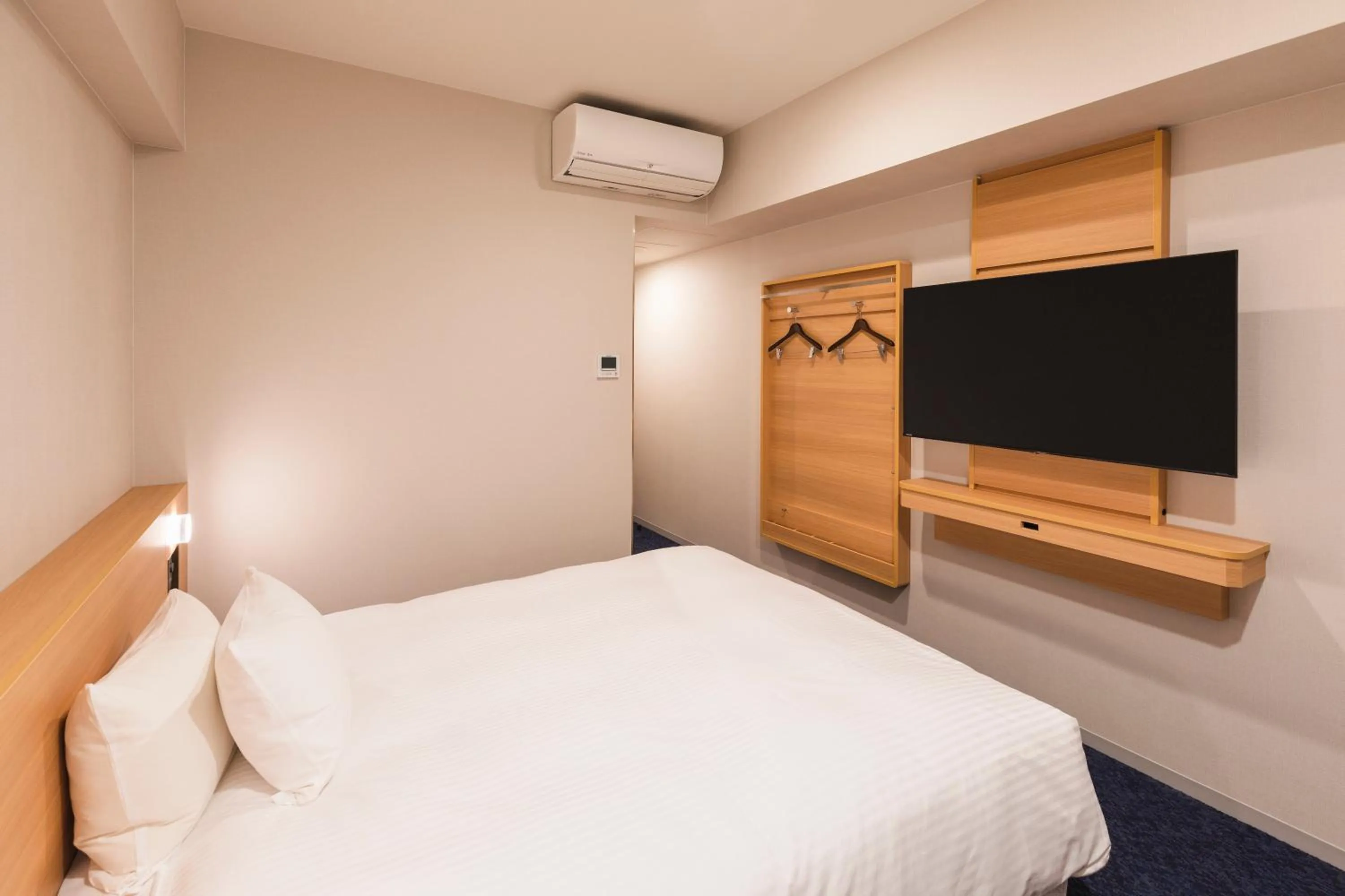 Bed in Sotetsu Grand Fresa Kumamoto