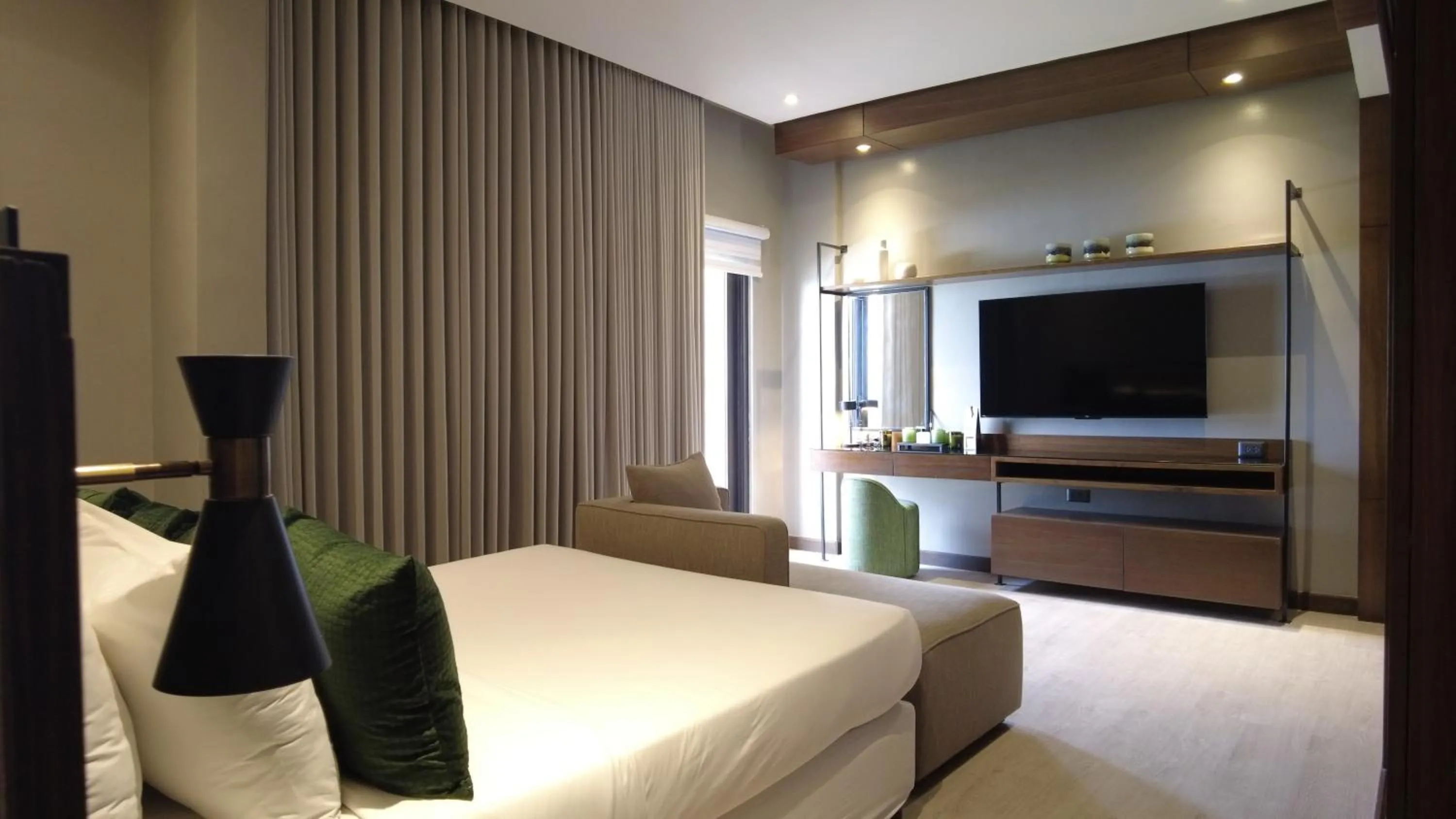 Communal lounge/ TV room, Bed in Acro Residences