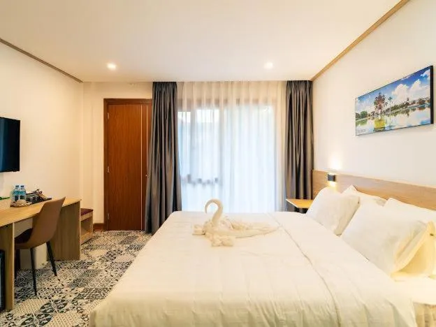 Bed in New Champa Boutique Hotel