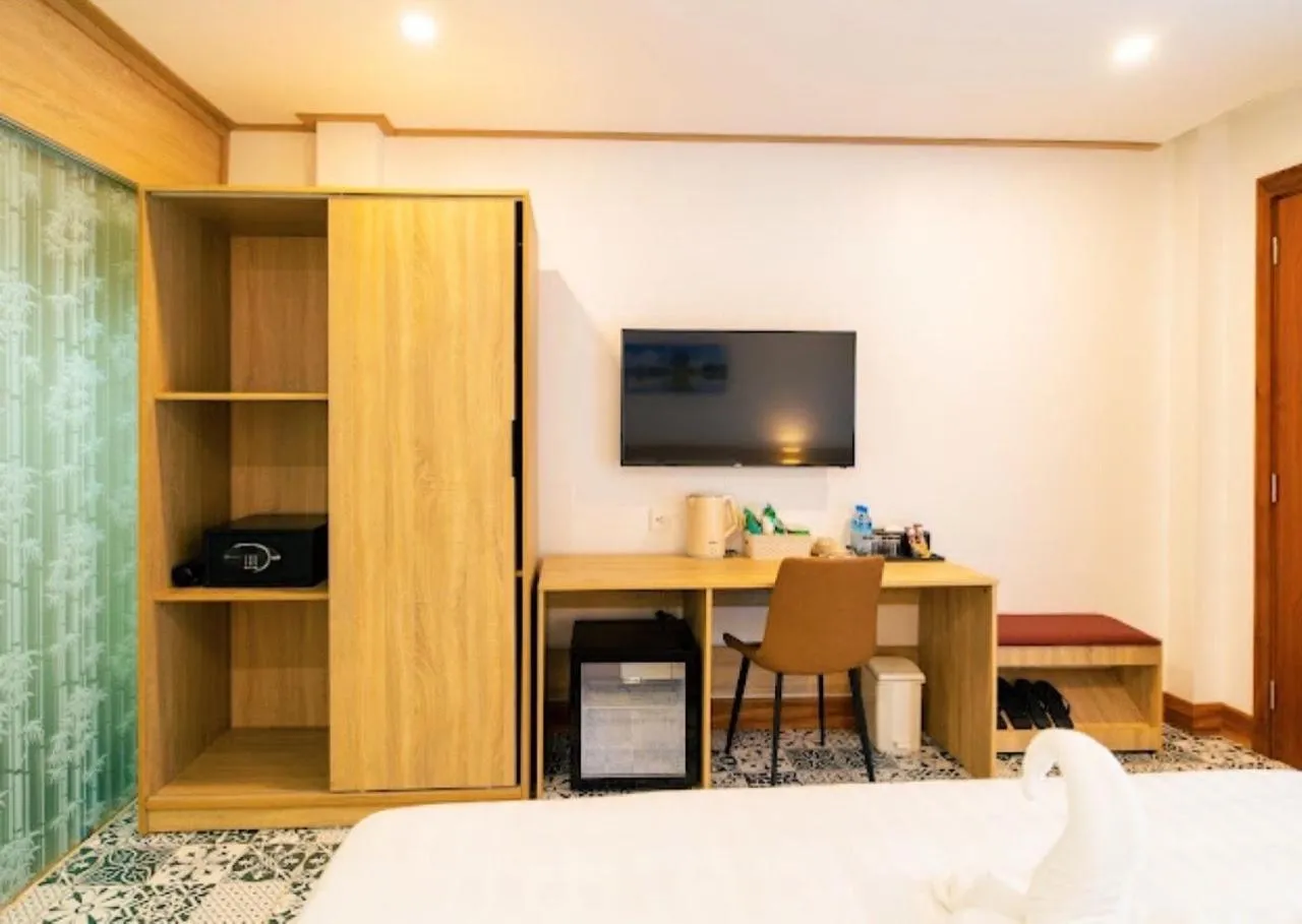 Bed in New Champa Boutique Hotel