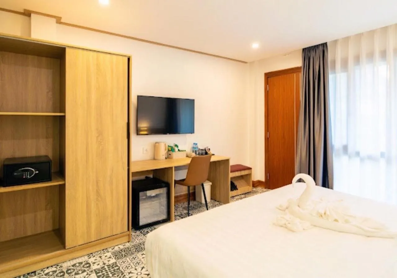 Bed in New Champa Boutique Hotel