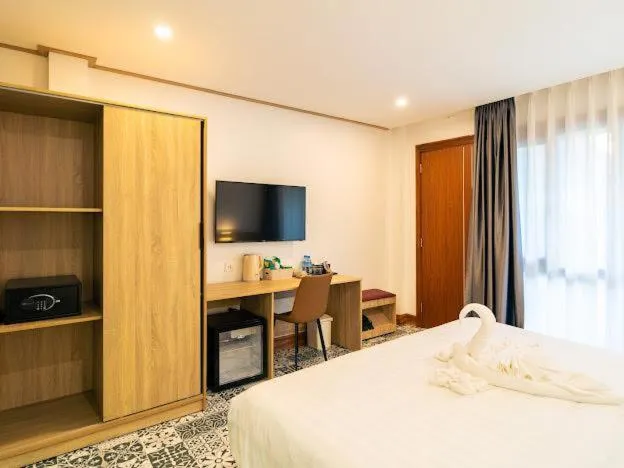 Bed in New Champa Boutique Hotel