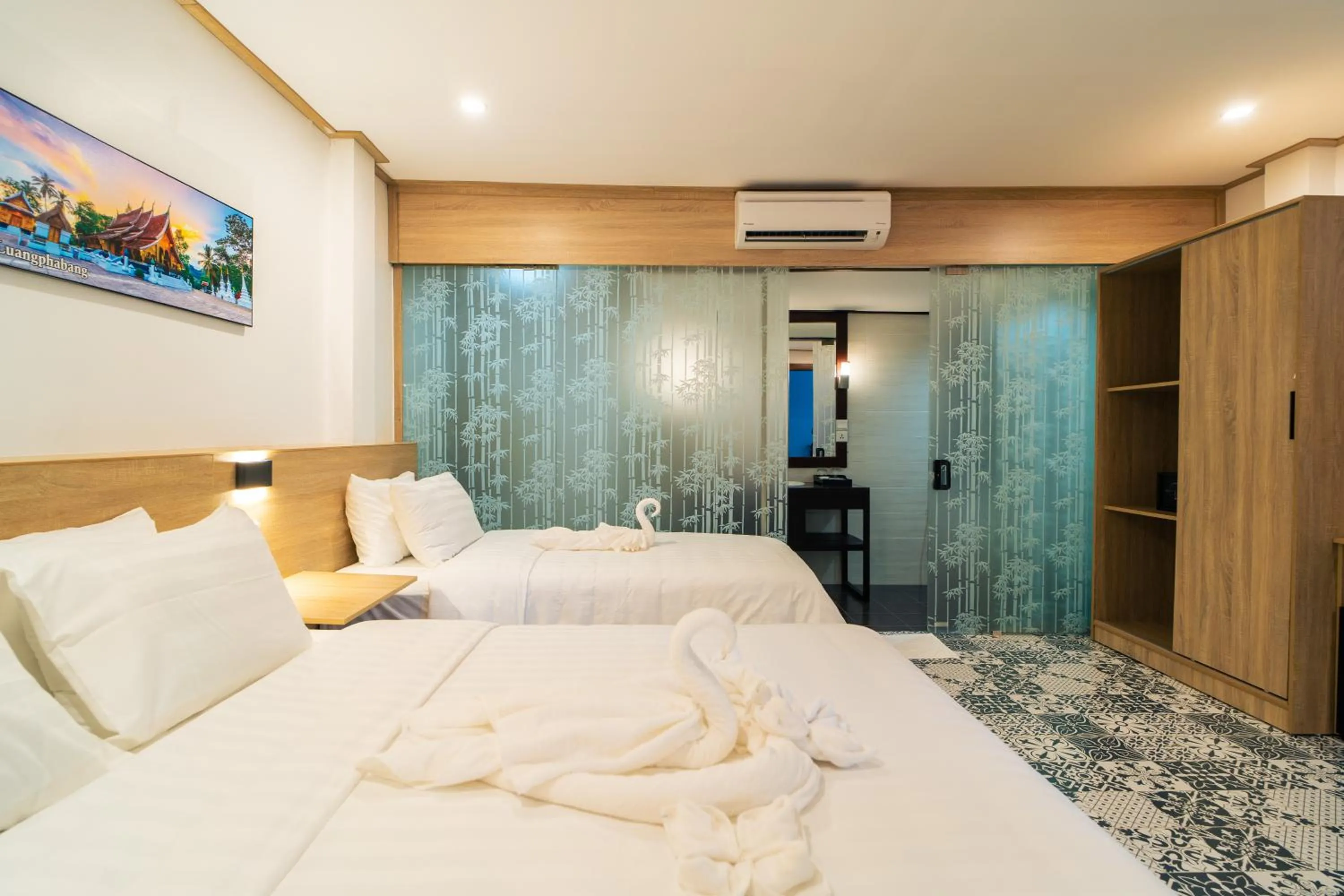 Bed in New Champa Boutique Hotel