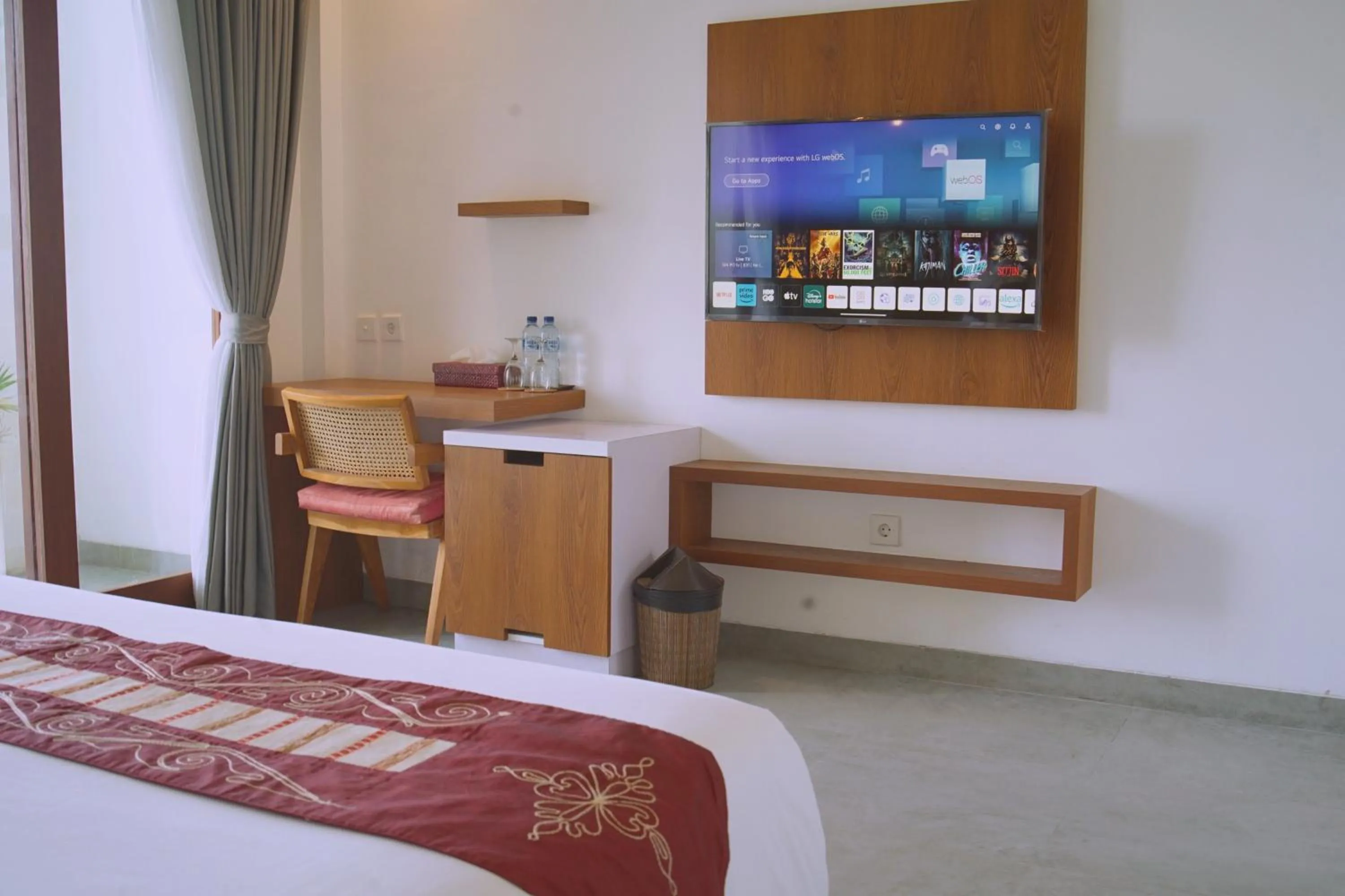 Bed in The Kd Suites & Coffee Shop