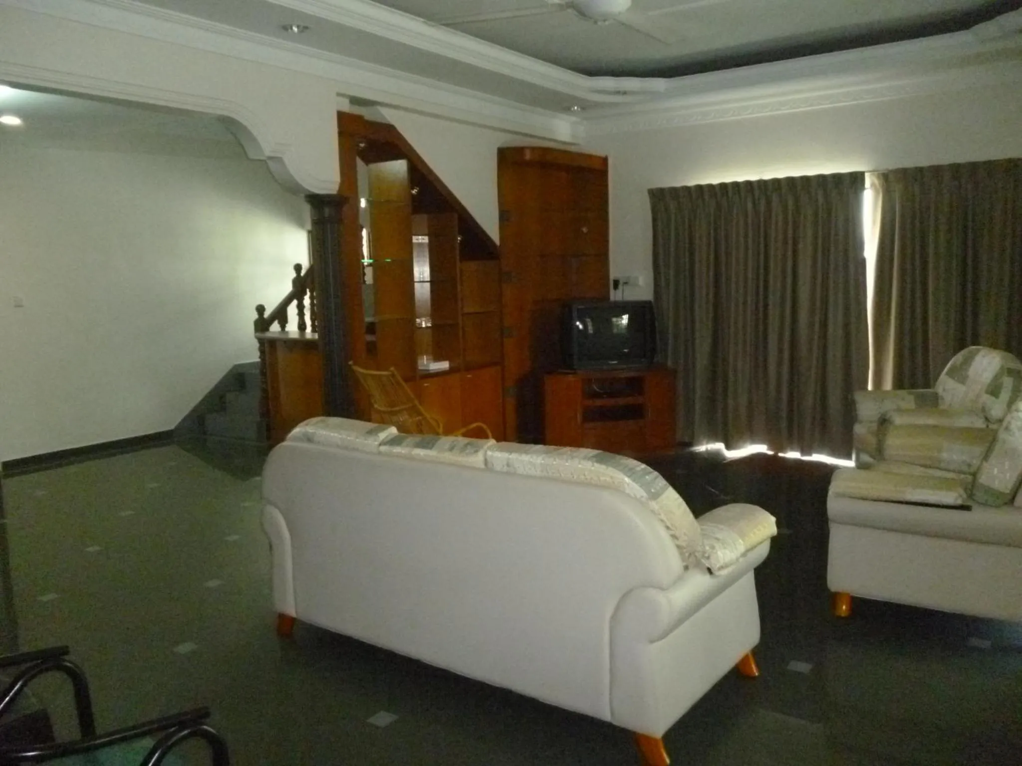 Communal lounge/ TV room in G Six Hotel