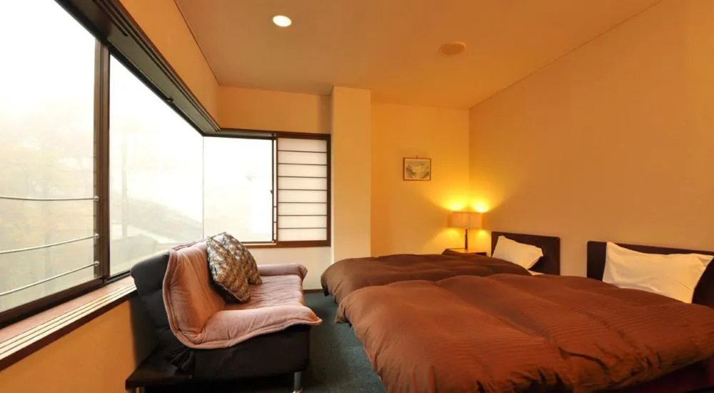 Bed in Tsubame Highland Lodge燕ハイランドロッジ