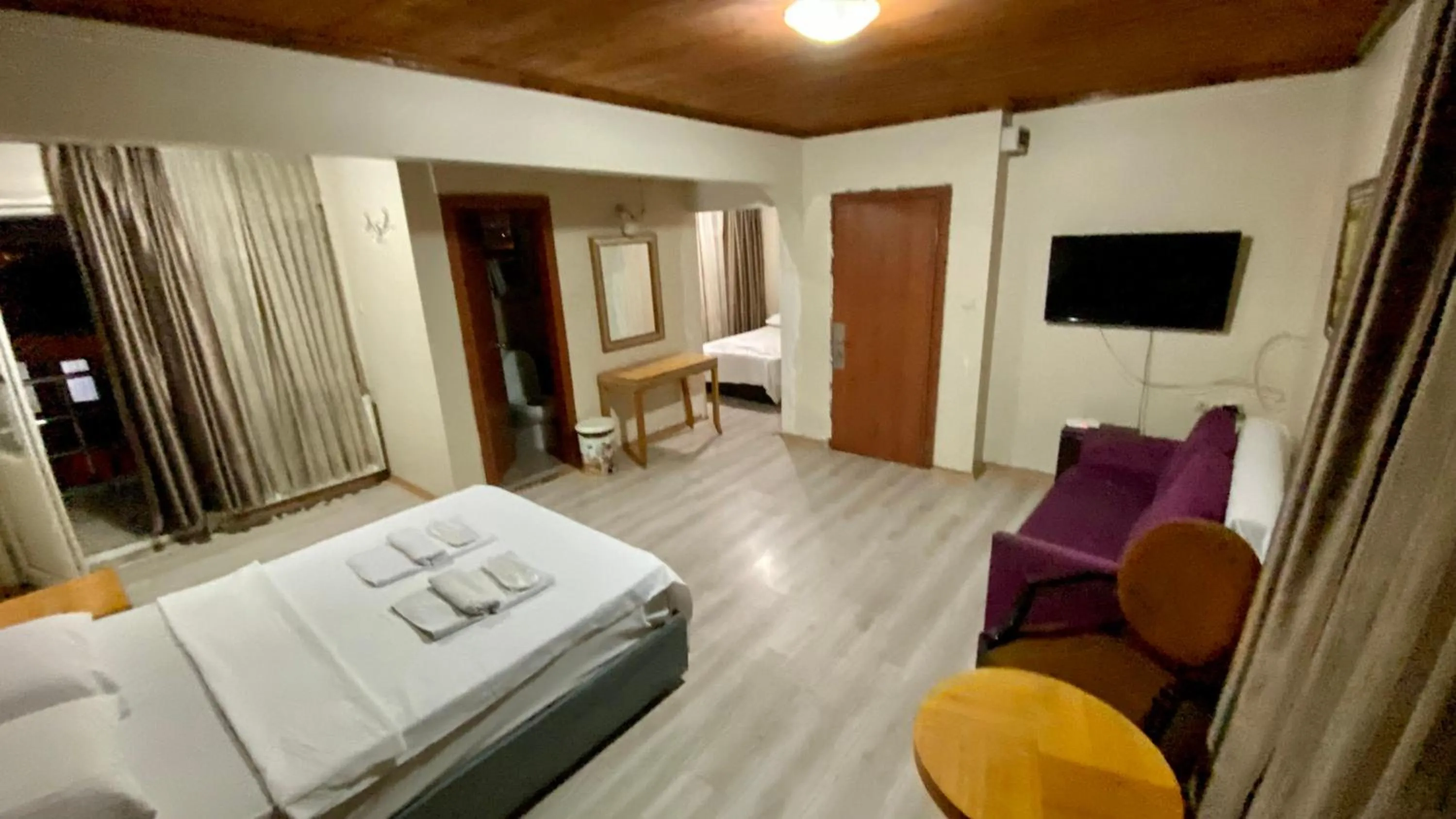 Communal lounge/ TV room, Bed in Herton Boutique Hotel