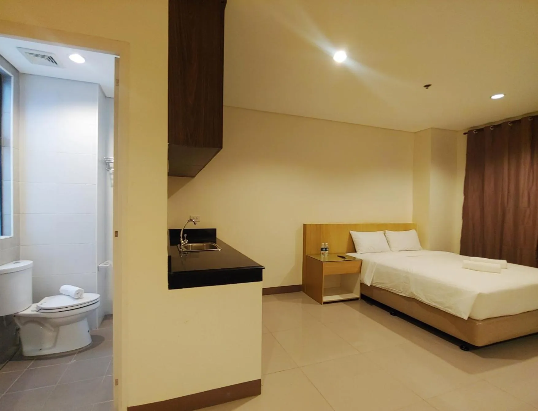 Photo of the whole room, Bed in Kaizen Suites