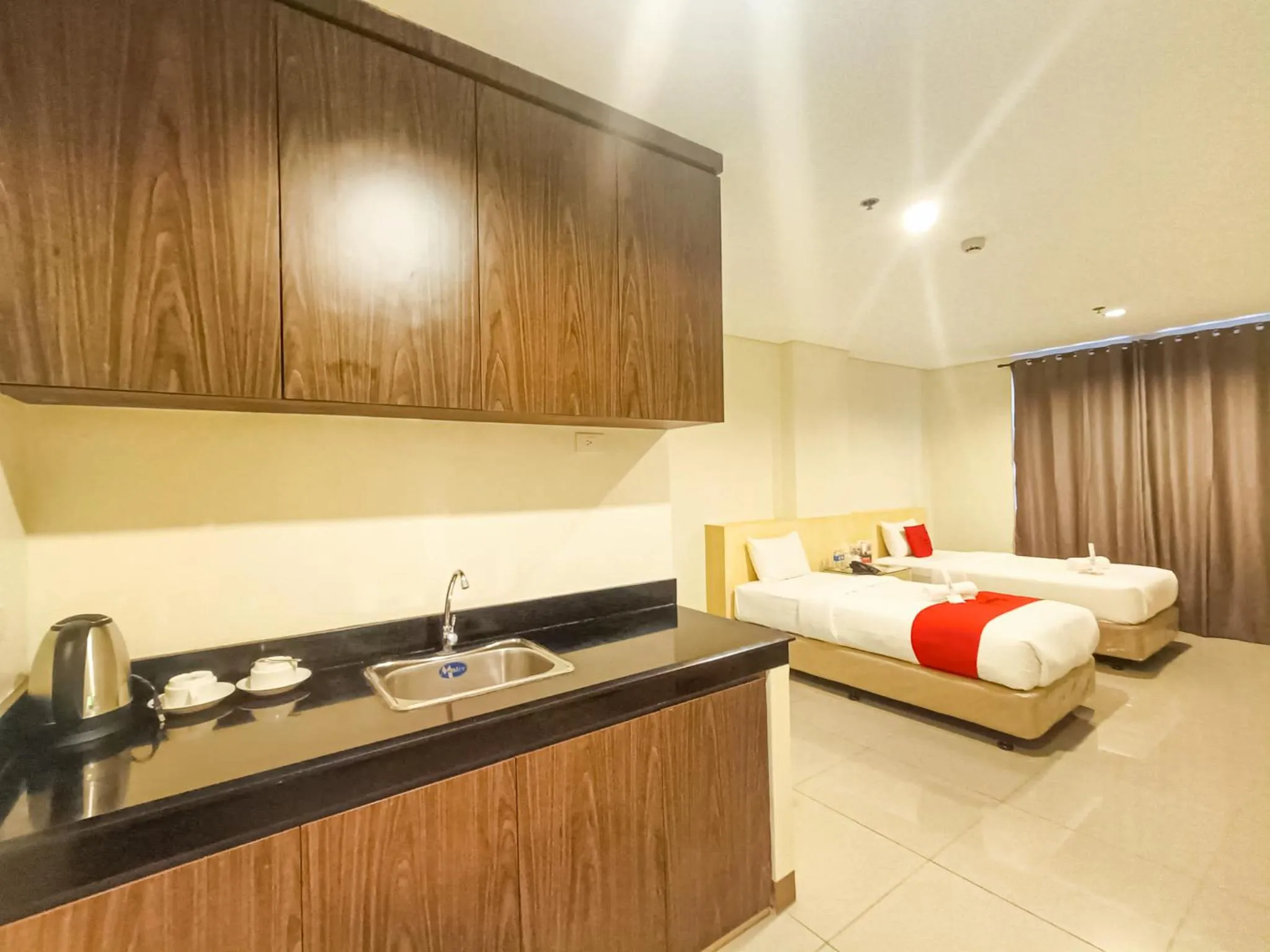 Kitchen or kitchenette, Bed in Kaizen Suites