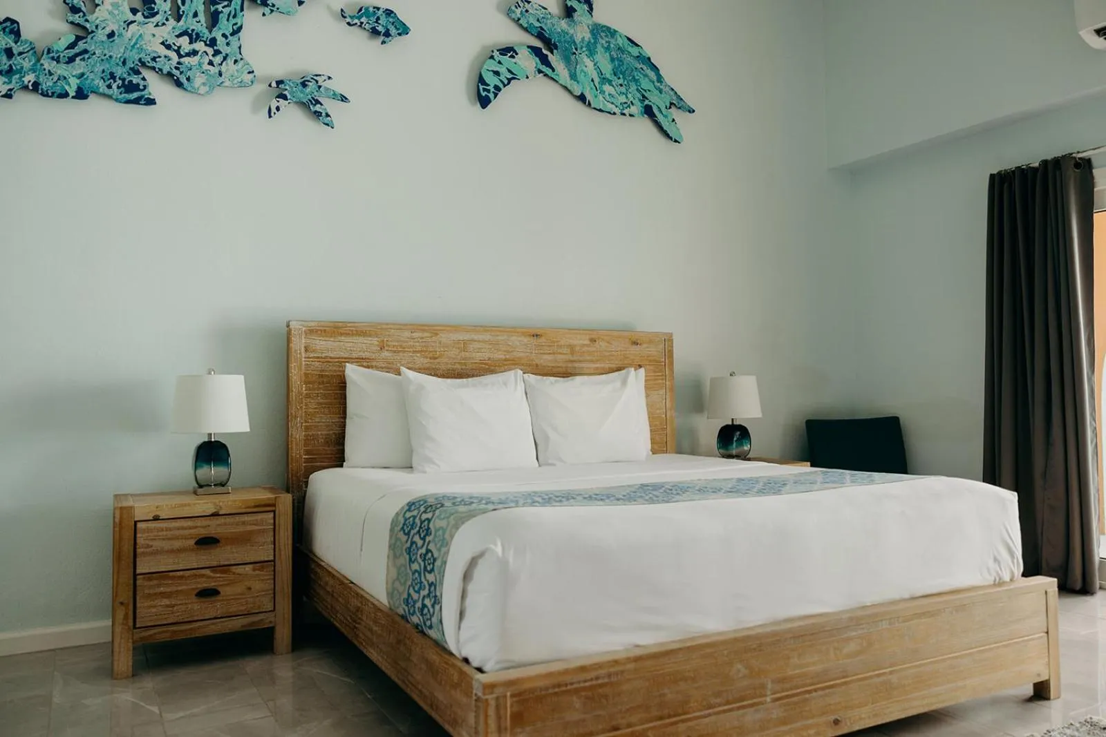 Bed in Grapetree Bay Hotel and Villas