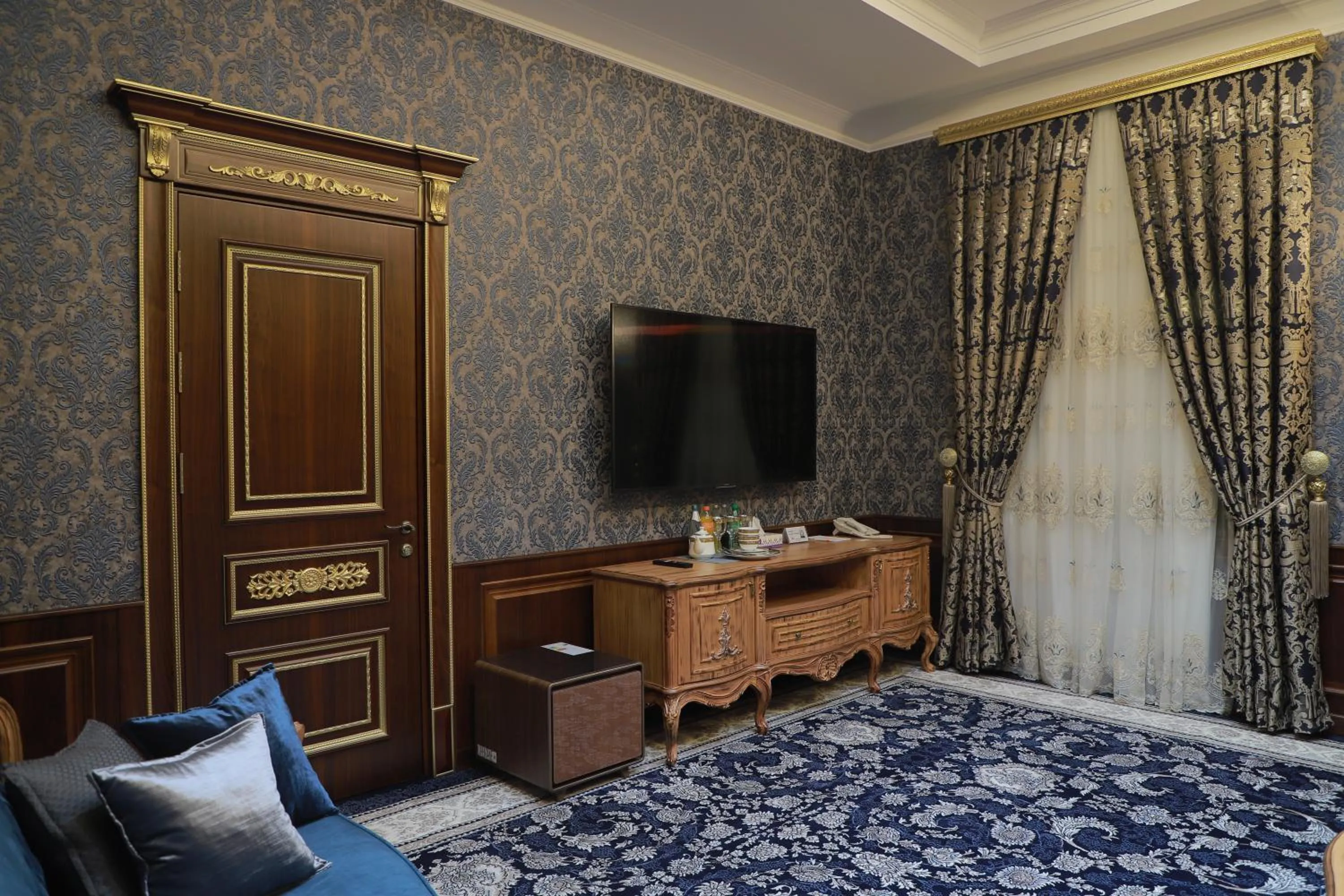 Seating area, Bed in Golden Samarkand Hotel