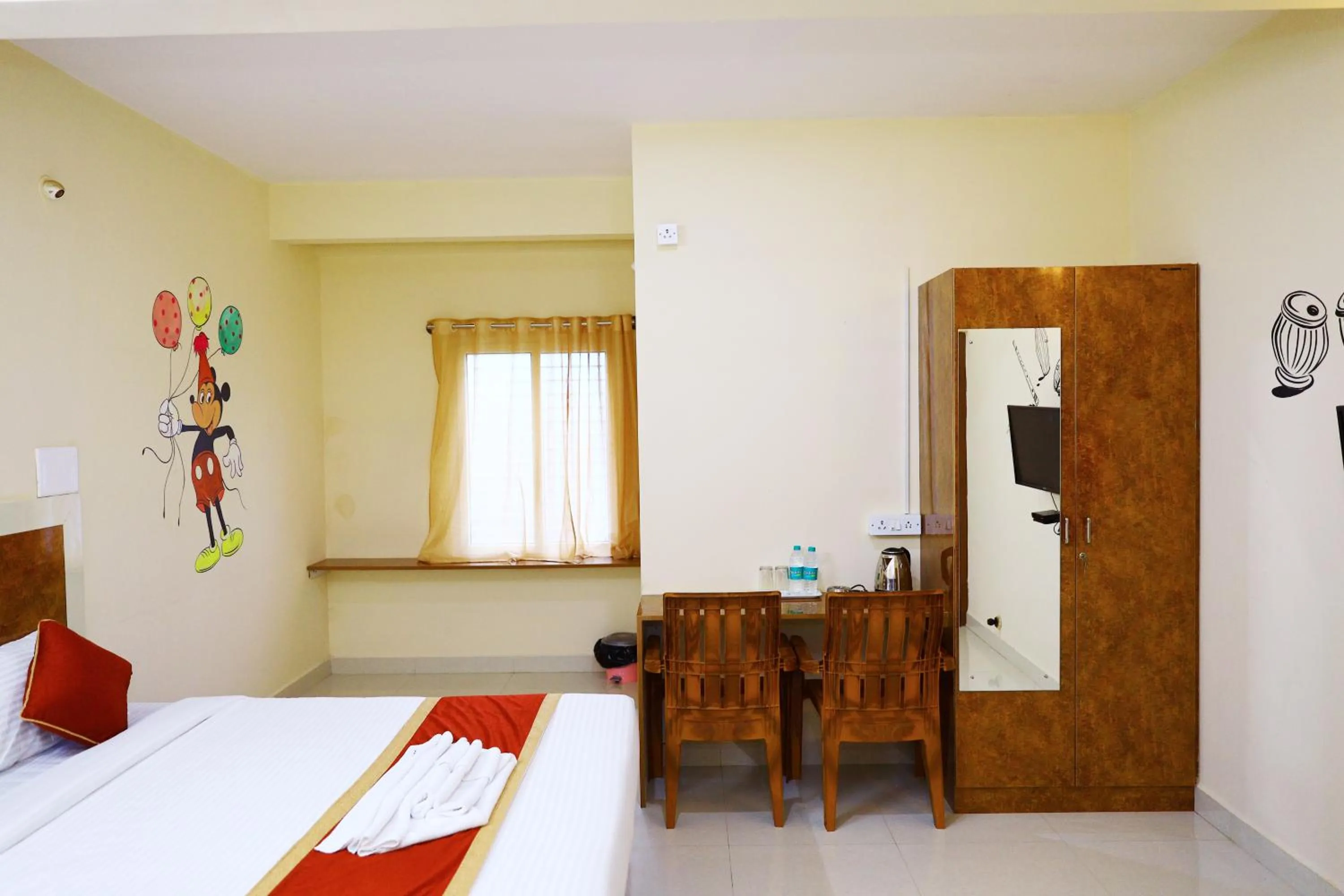 Photo of the whole room, Bed in Sasthi Suites