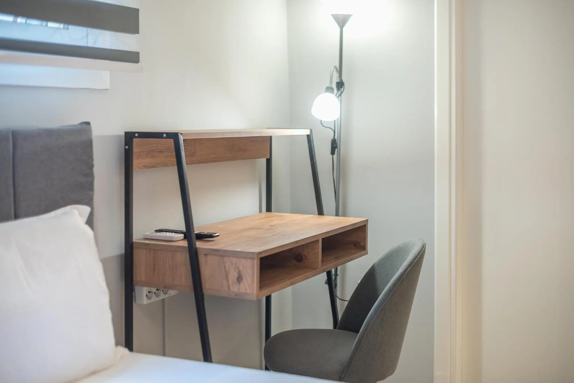 Living room, Bed in The Boutique Studio by CloudKeys