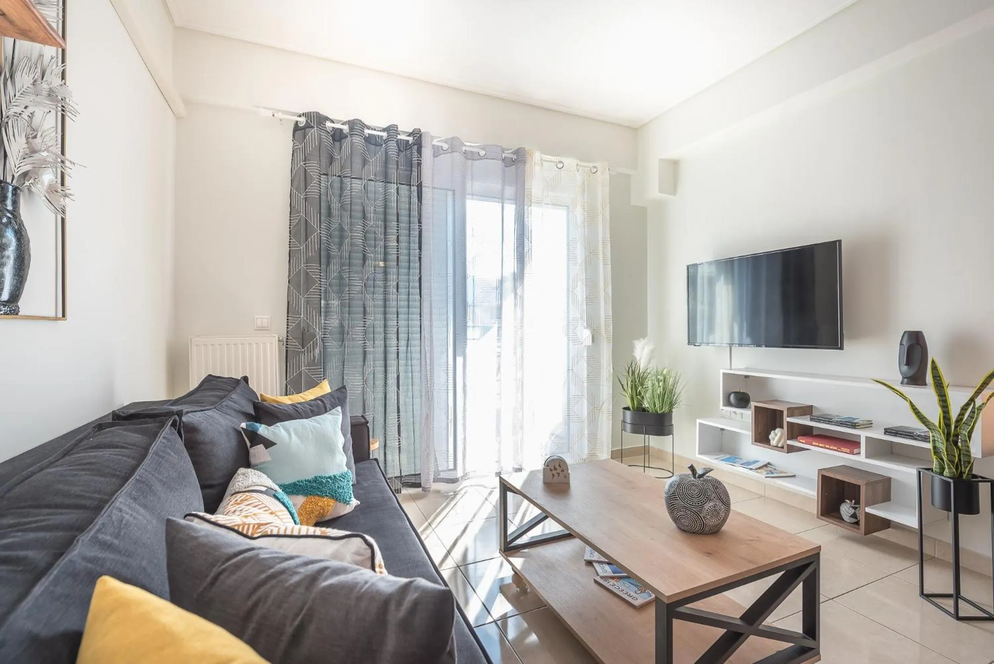 TV and multimedia in Elegant Home with Balcony by CloudKeys