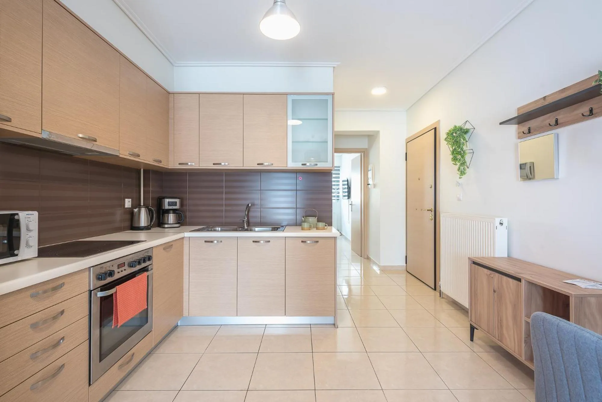 Kitchen or kitchenette in Elegant Home with Balcony by CloudKeys