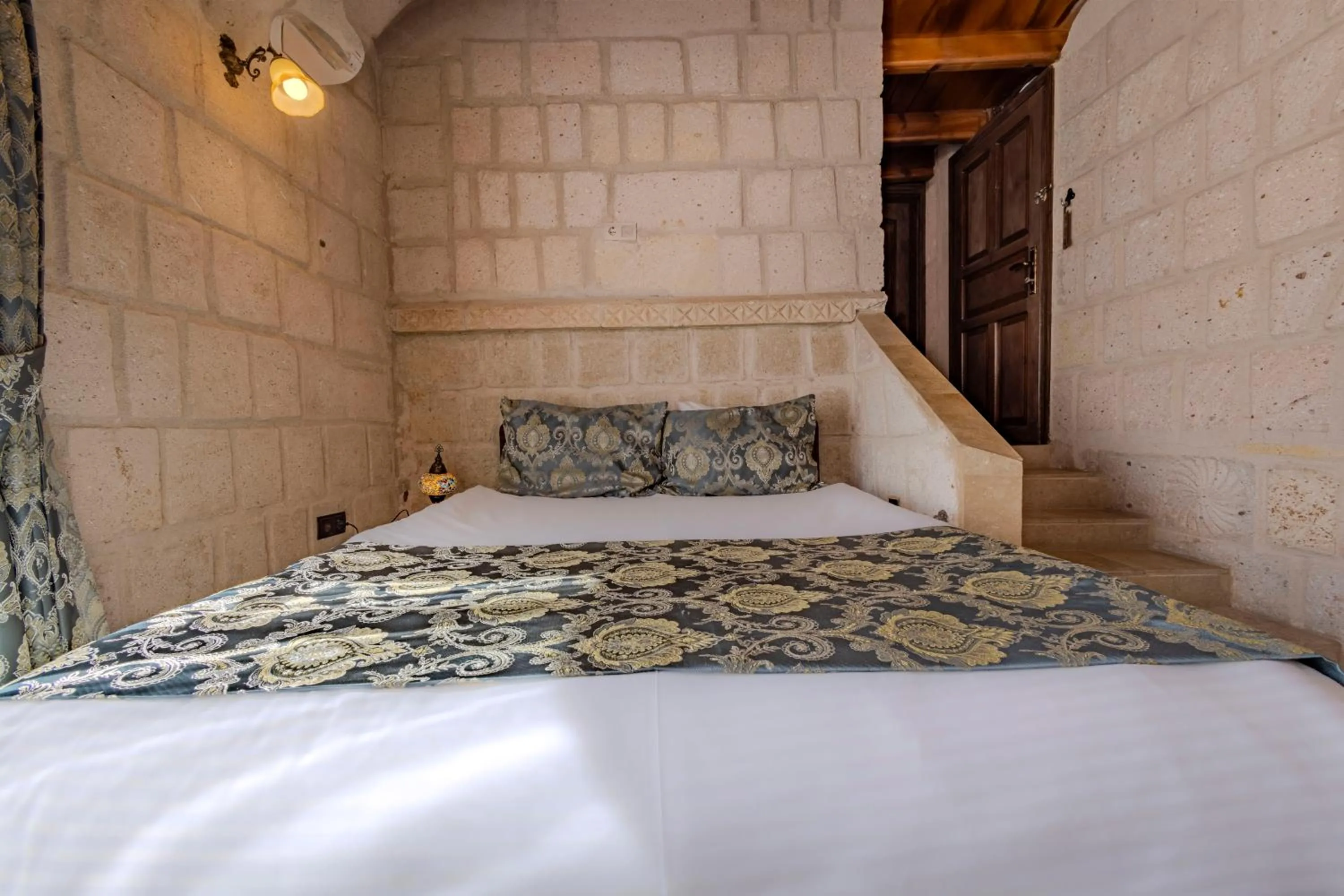 Bed in Ascension Cave Suites - Special Class