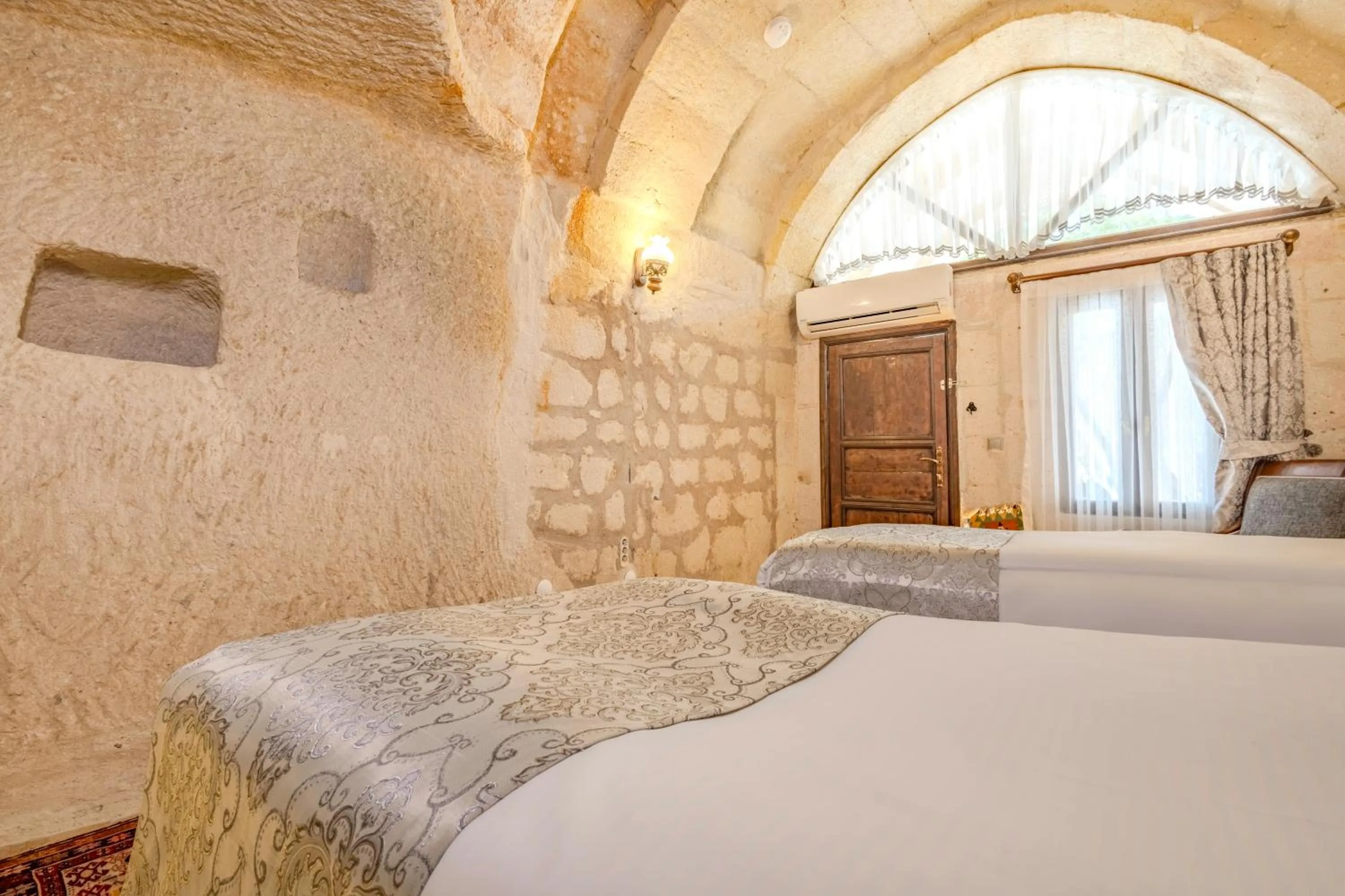 Bed in Ascension Cave Suites - Special Class
