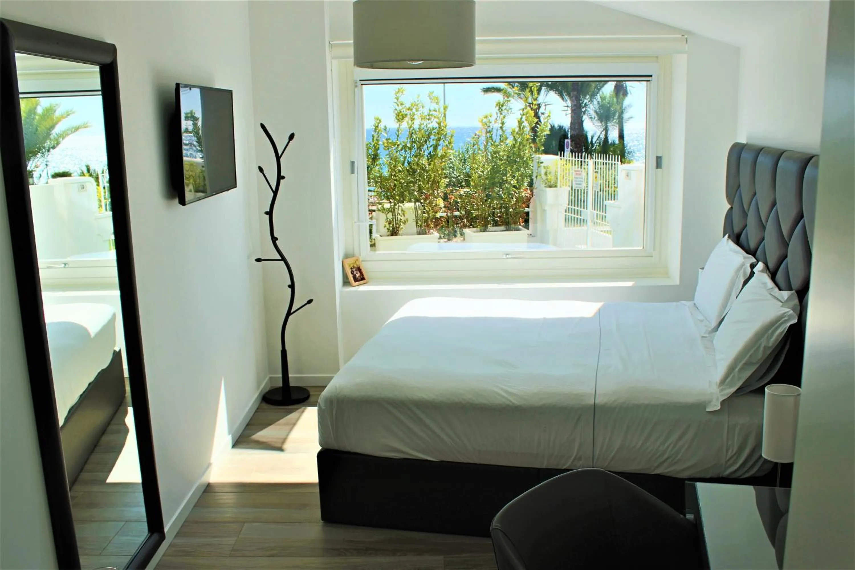 Bed in Sanremo Luxury Suites