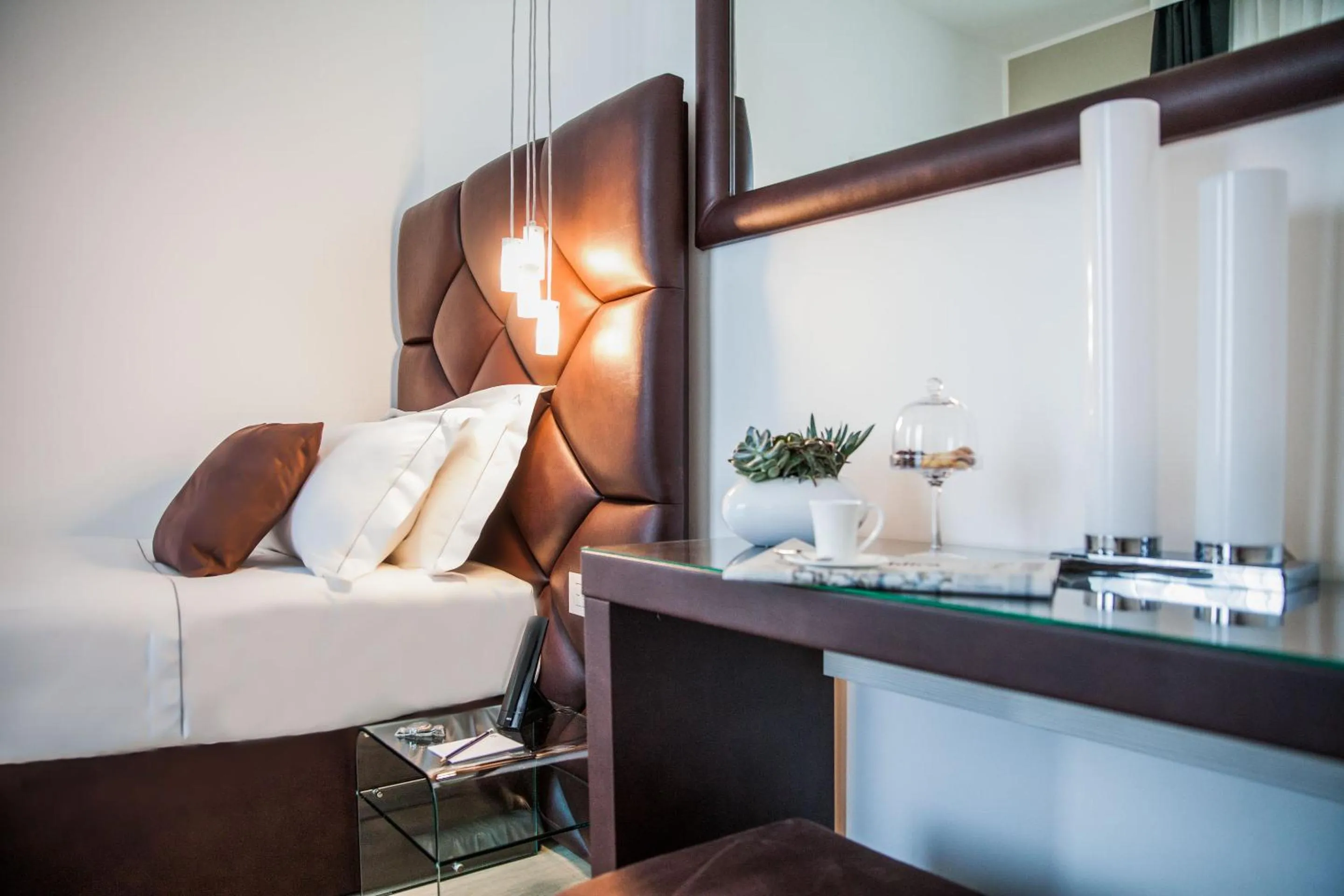 Bed in Sanremo Luxury Suites