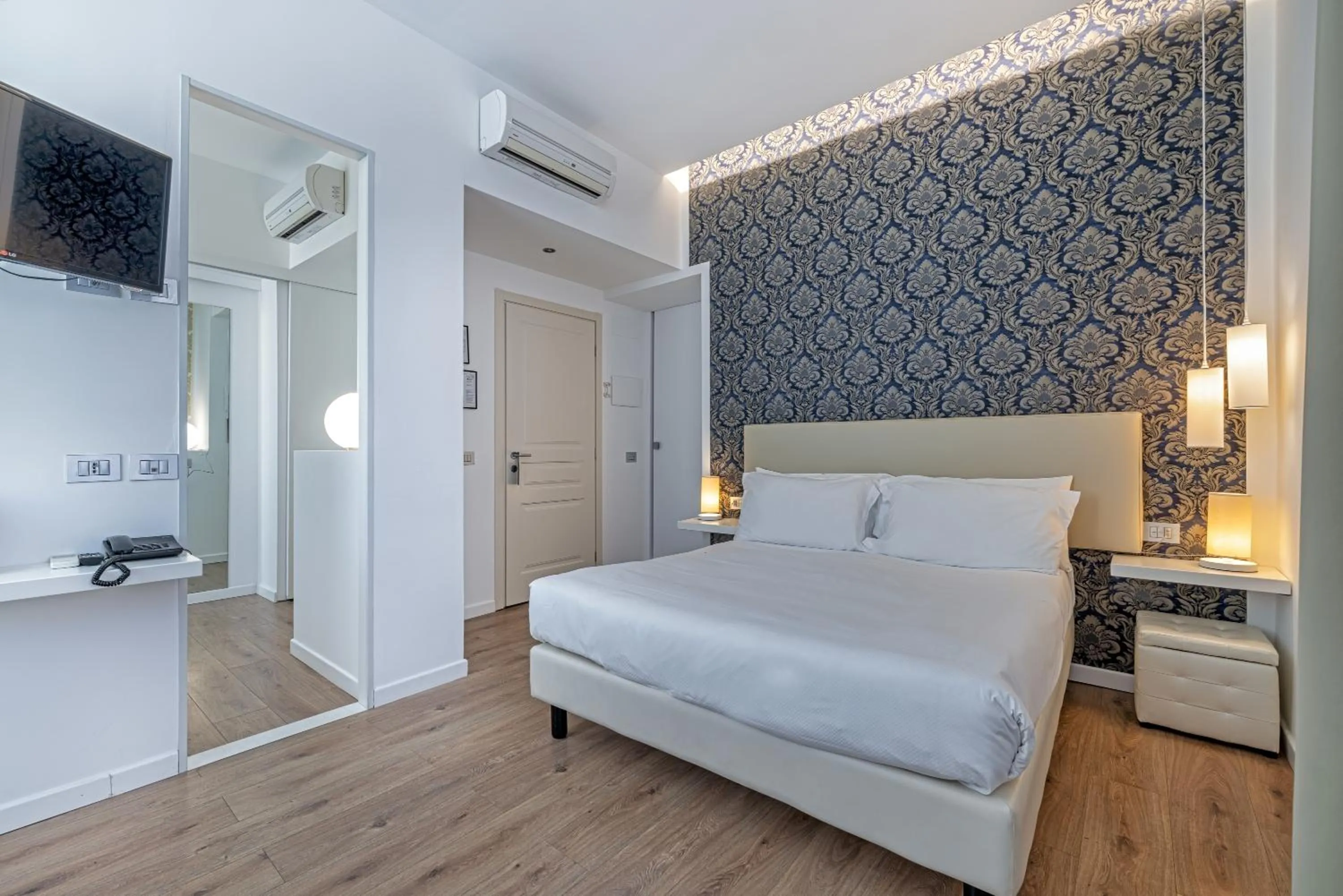 Bed in Sanremo Luxury Suites