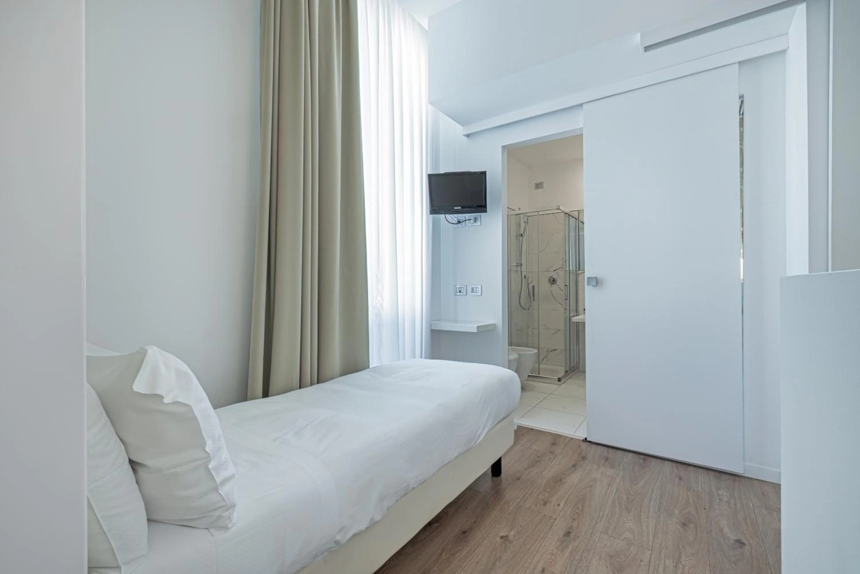 Bed in Sanremo Luxury Suites