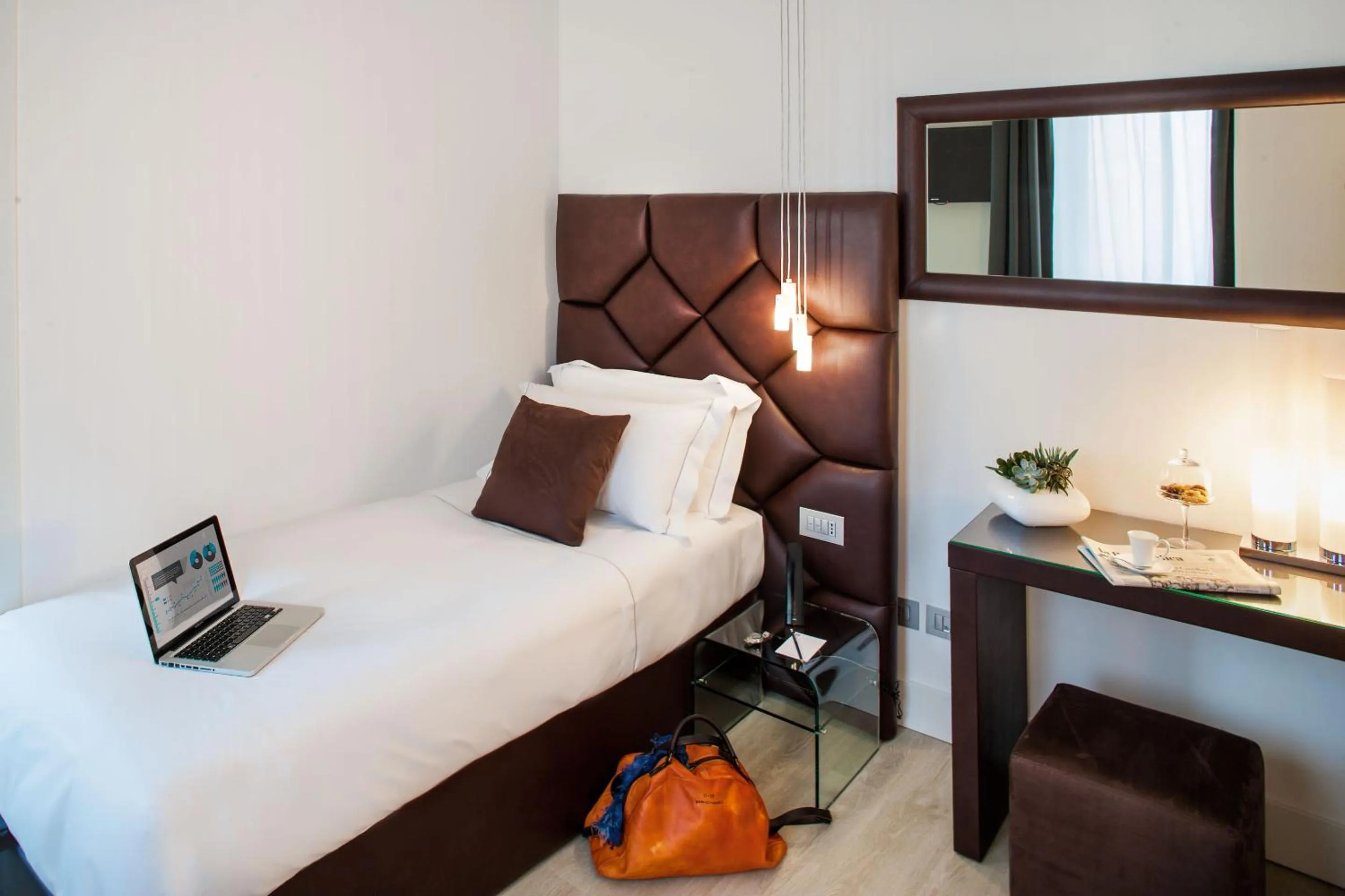 Bed in Sanremo Luxury Suites