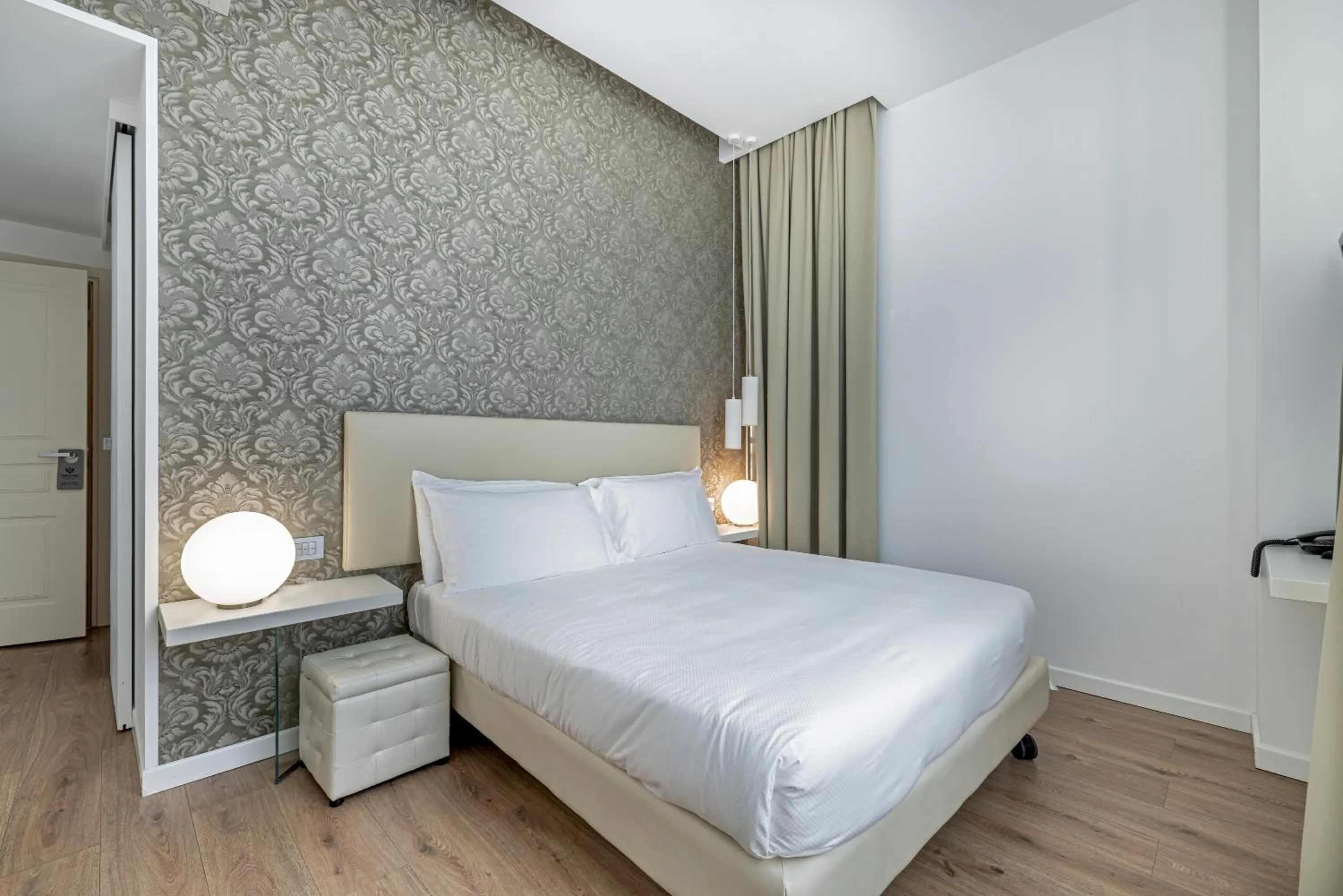 Bed in Sanremo Luxury Suites