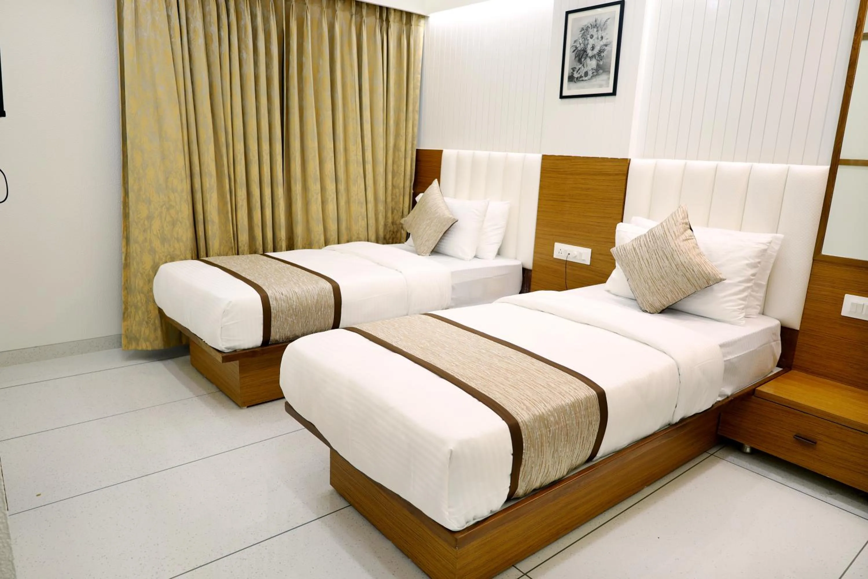 Bed in Tulsi Hotel