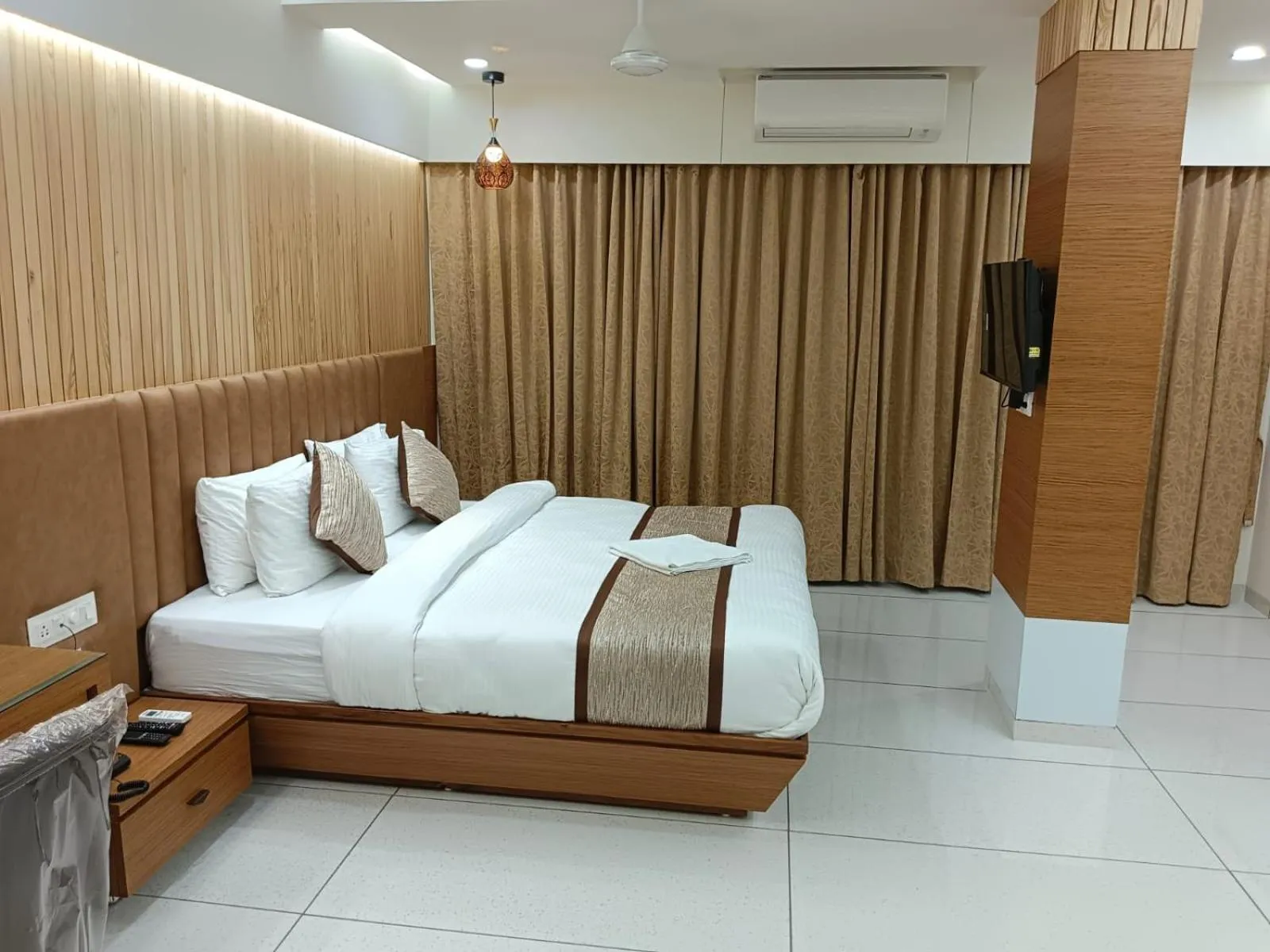 Bed in Tulsi Hotel