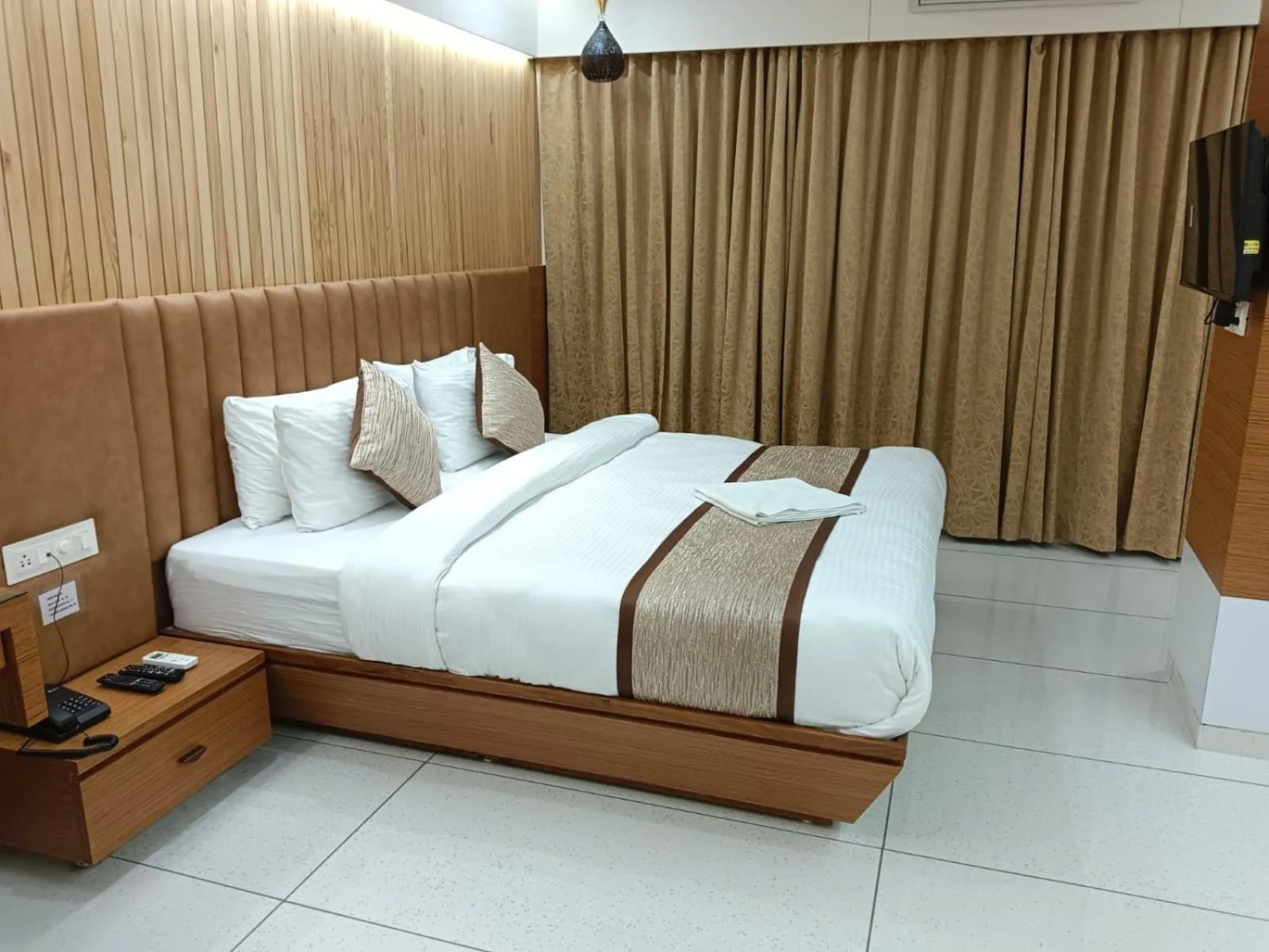 Bed in Tulsi Hotel