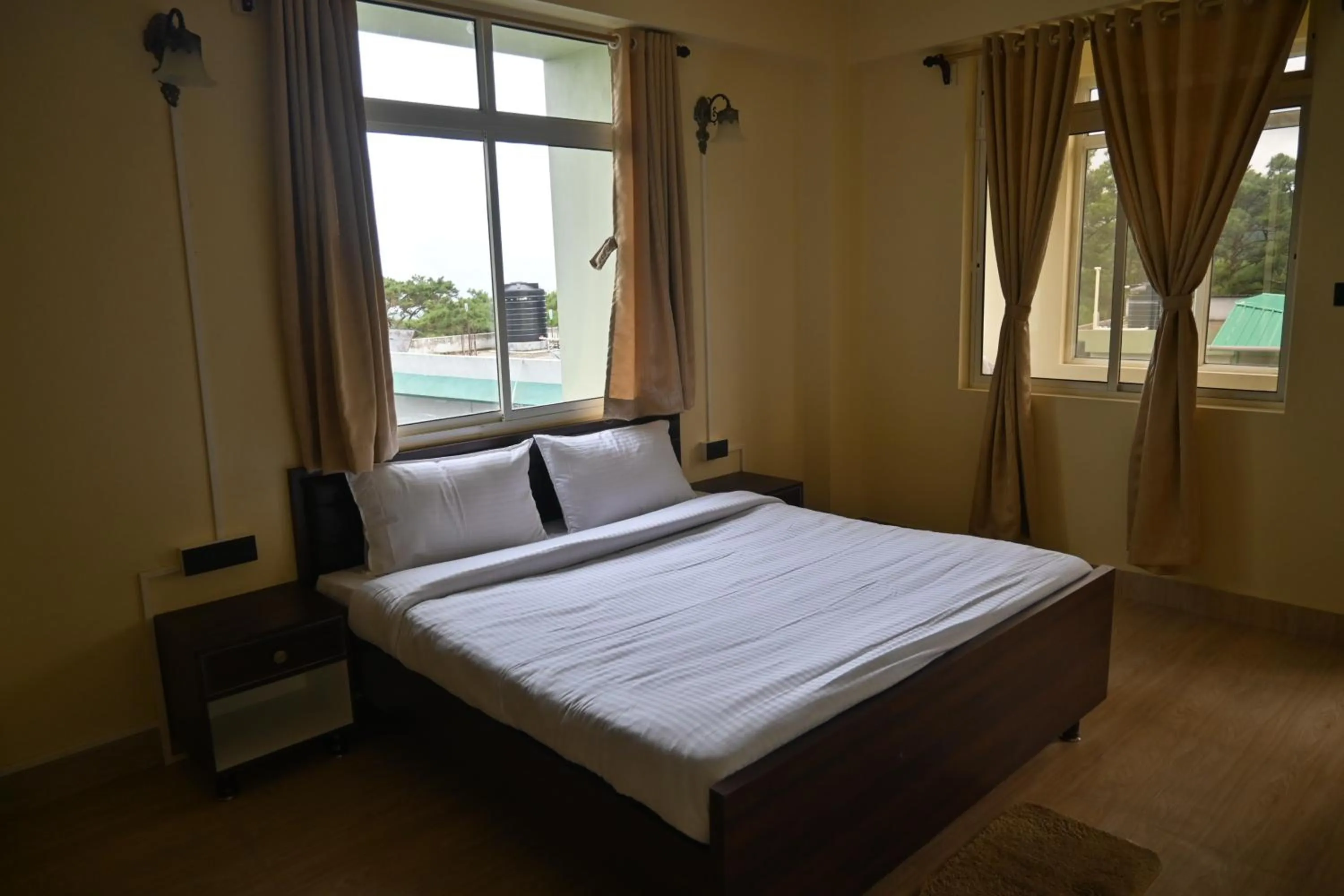 Bedroom in TreeTops Residency