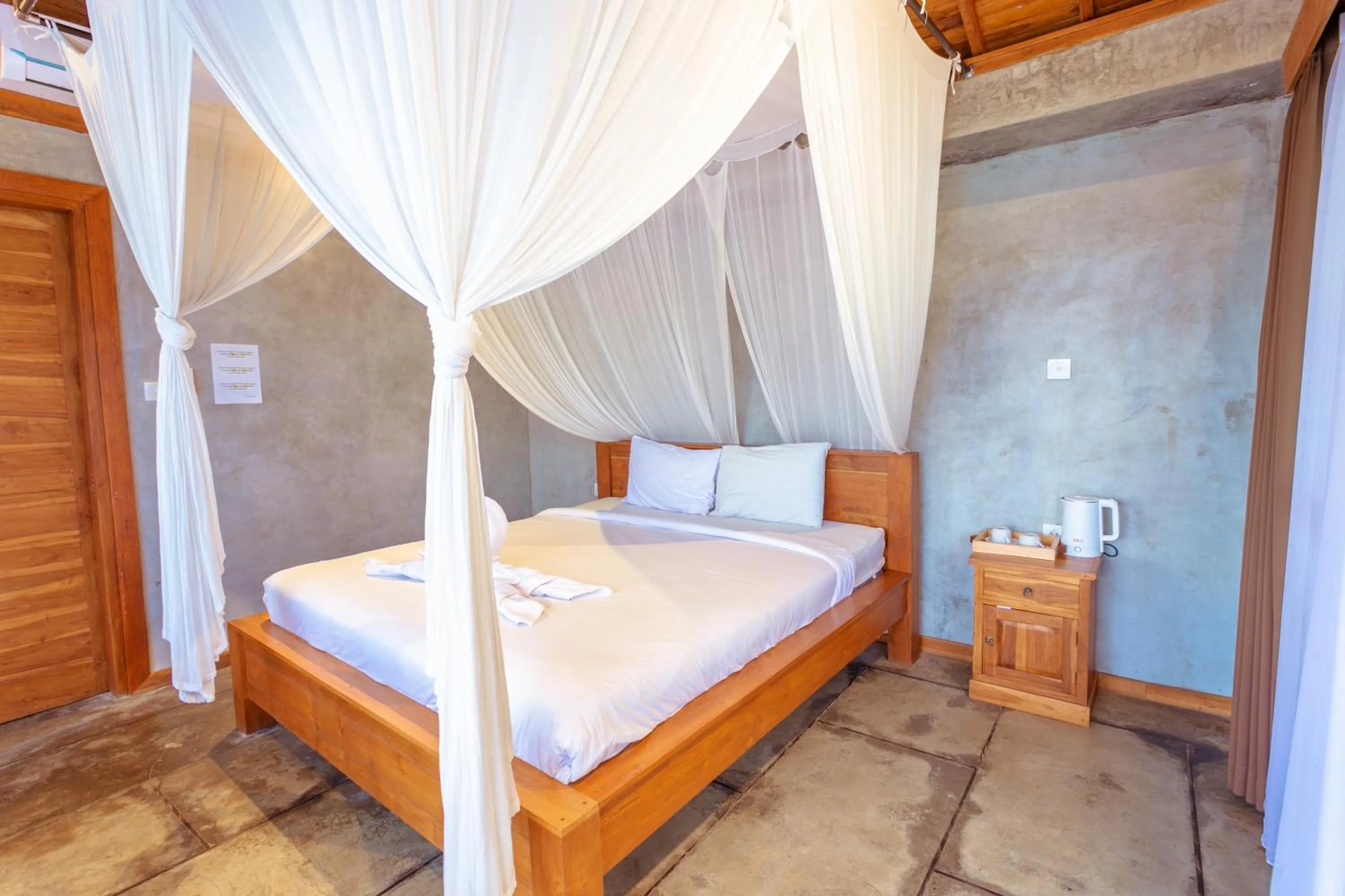 Bed in Kubu D'Carik Villa & Bungalow by ecommerceloka