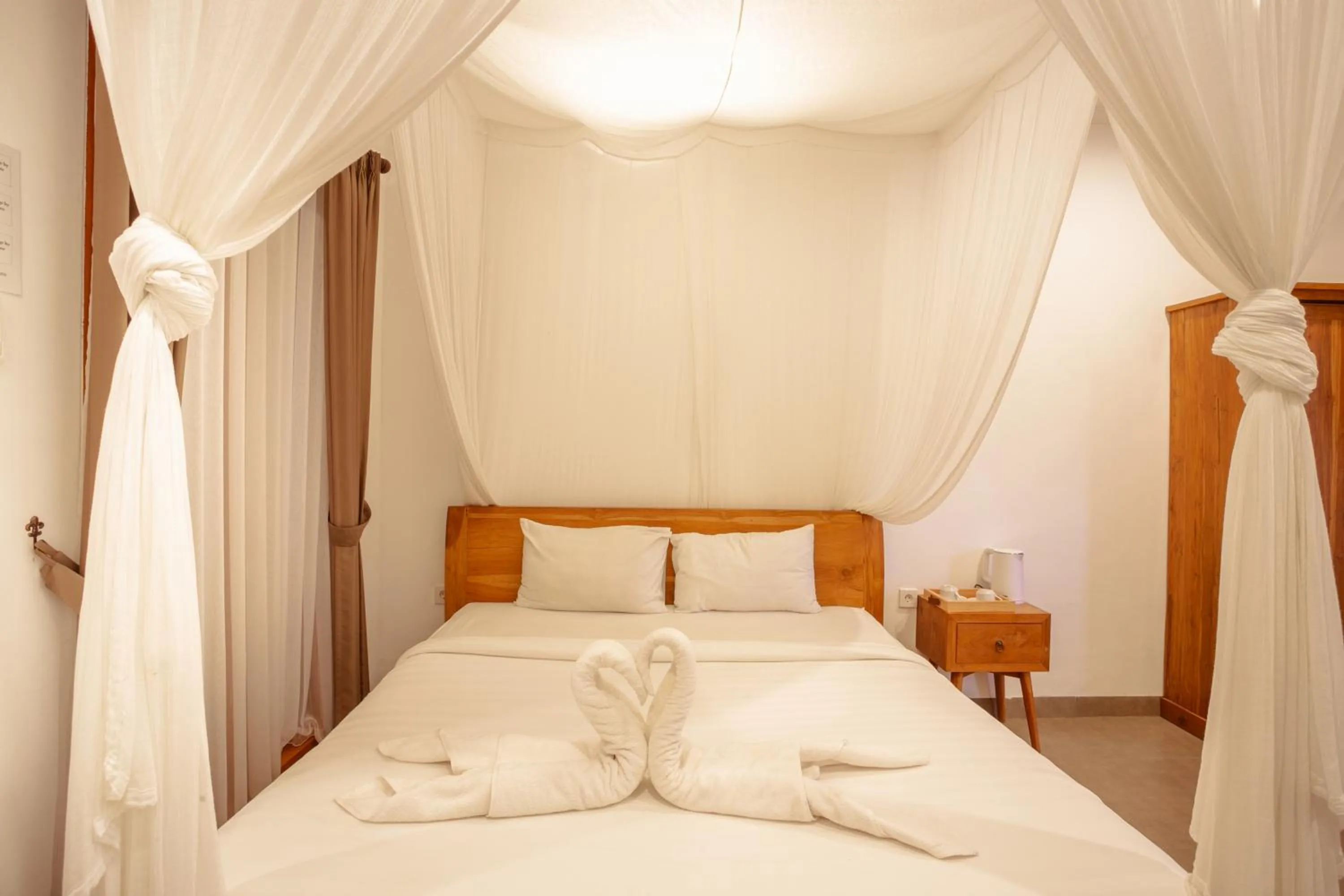 Bed in Kubu D'Carik Villa & Bungalow by ecommerceloka