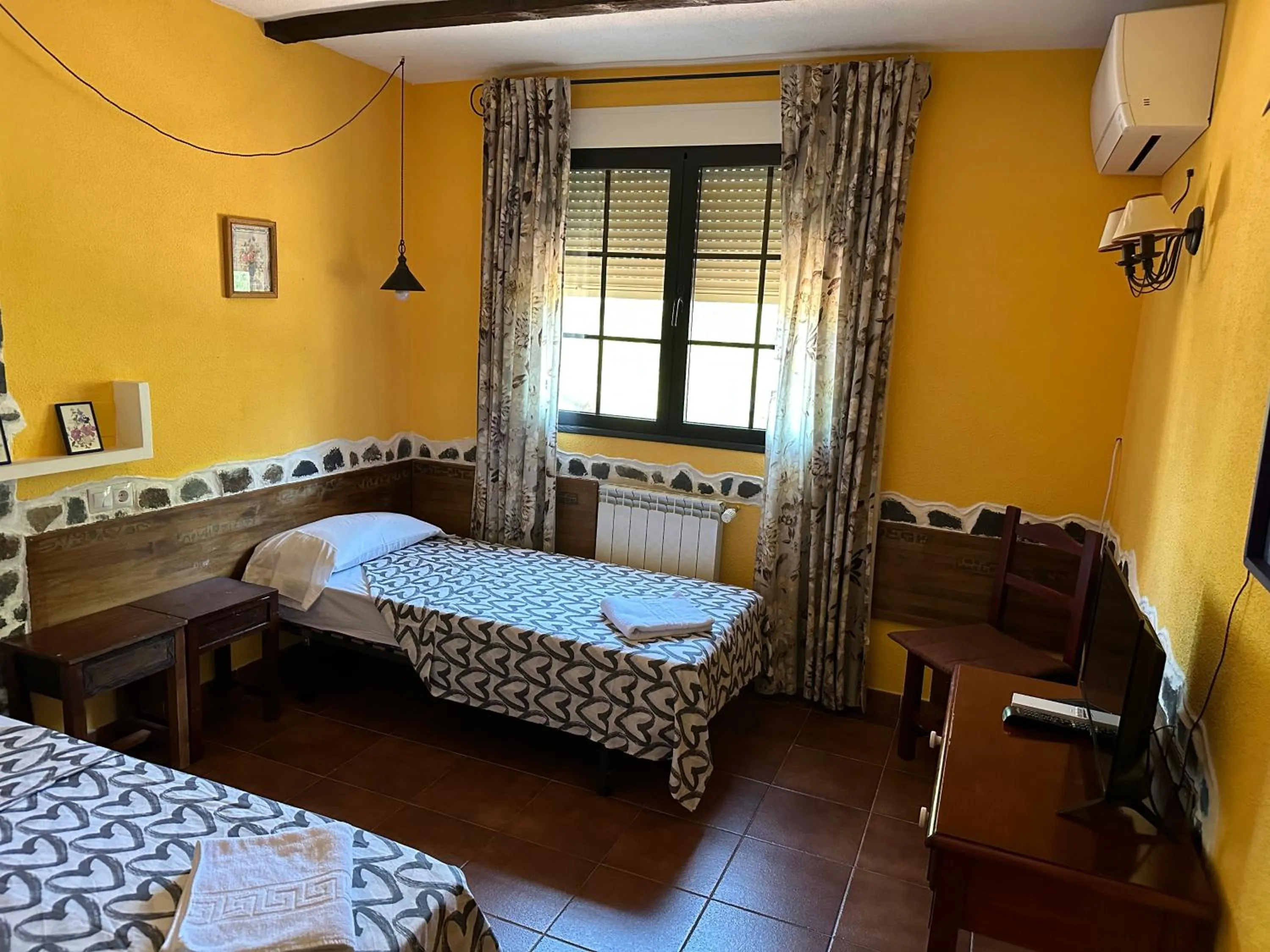 Bed in Hotel rural LA CASONA DE TAMAYA