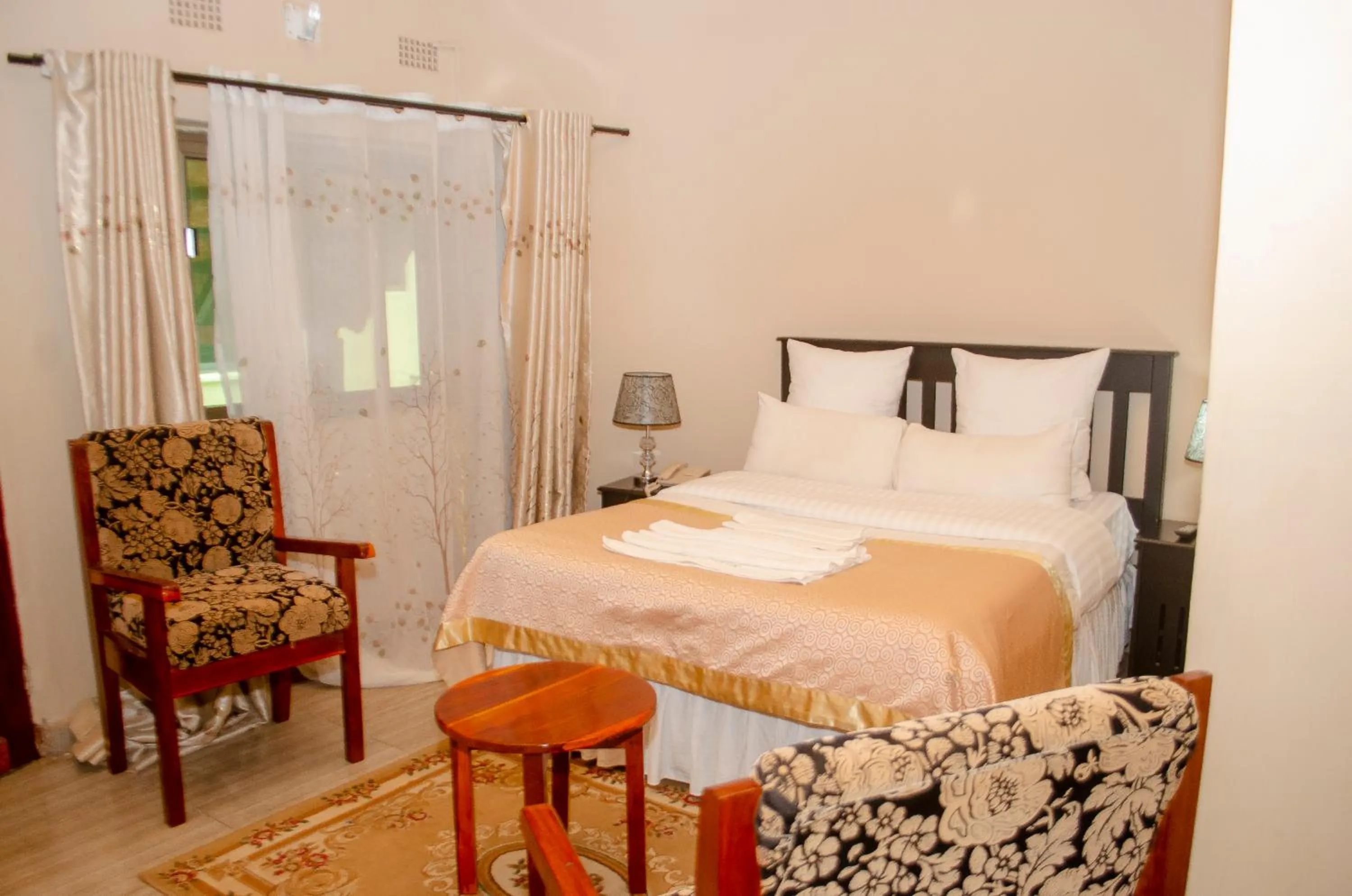 Bed in ROYAL SHALOM HOTEL