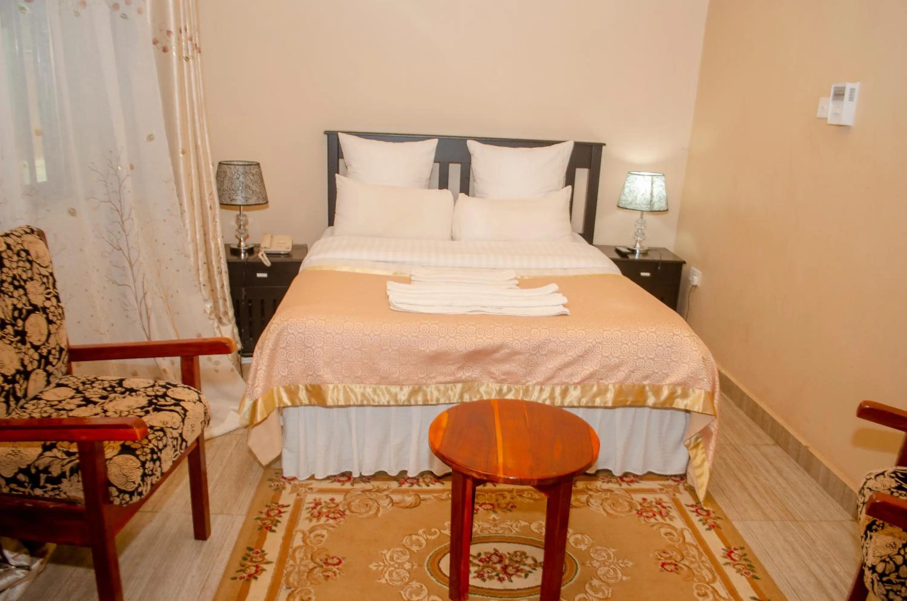 Bed in ROYAL SHALOM HOTEL