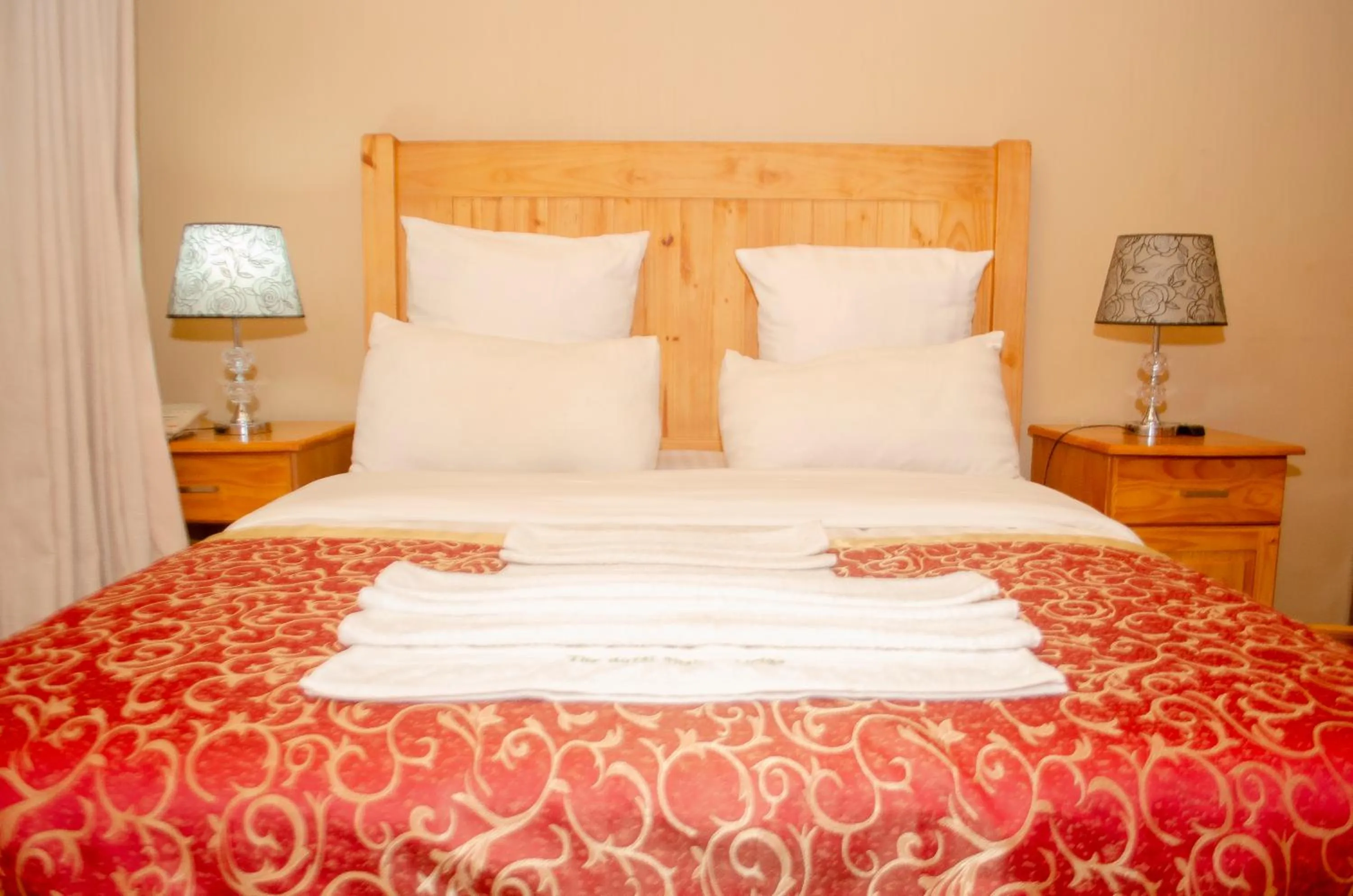 Bed in ROYAL SHALOM HOTEL