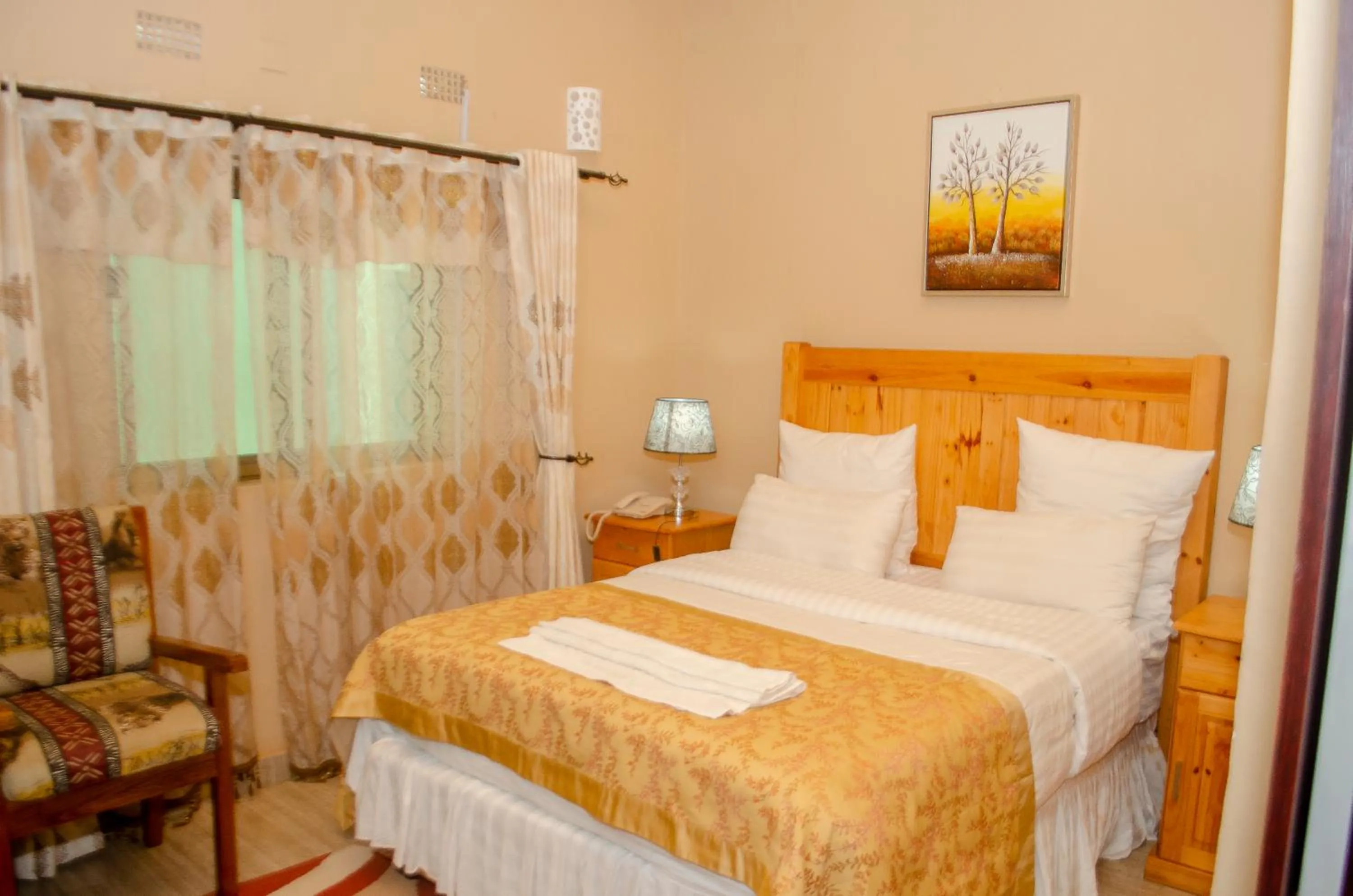 Bed in ROYAL SHALOM HOTEL