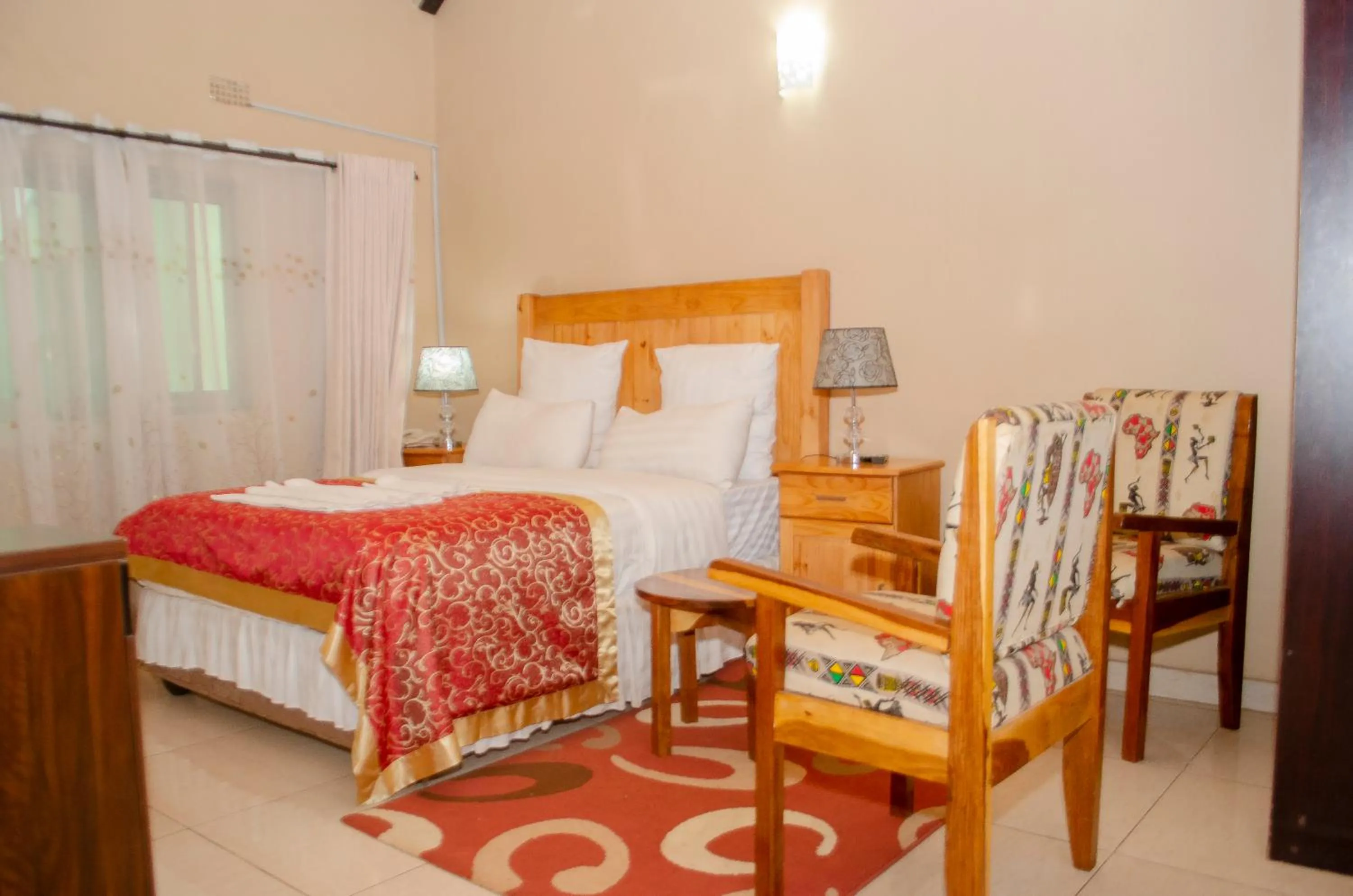 Bed in ROYAL SHALOM HOTEL