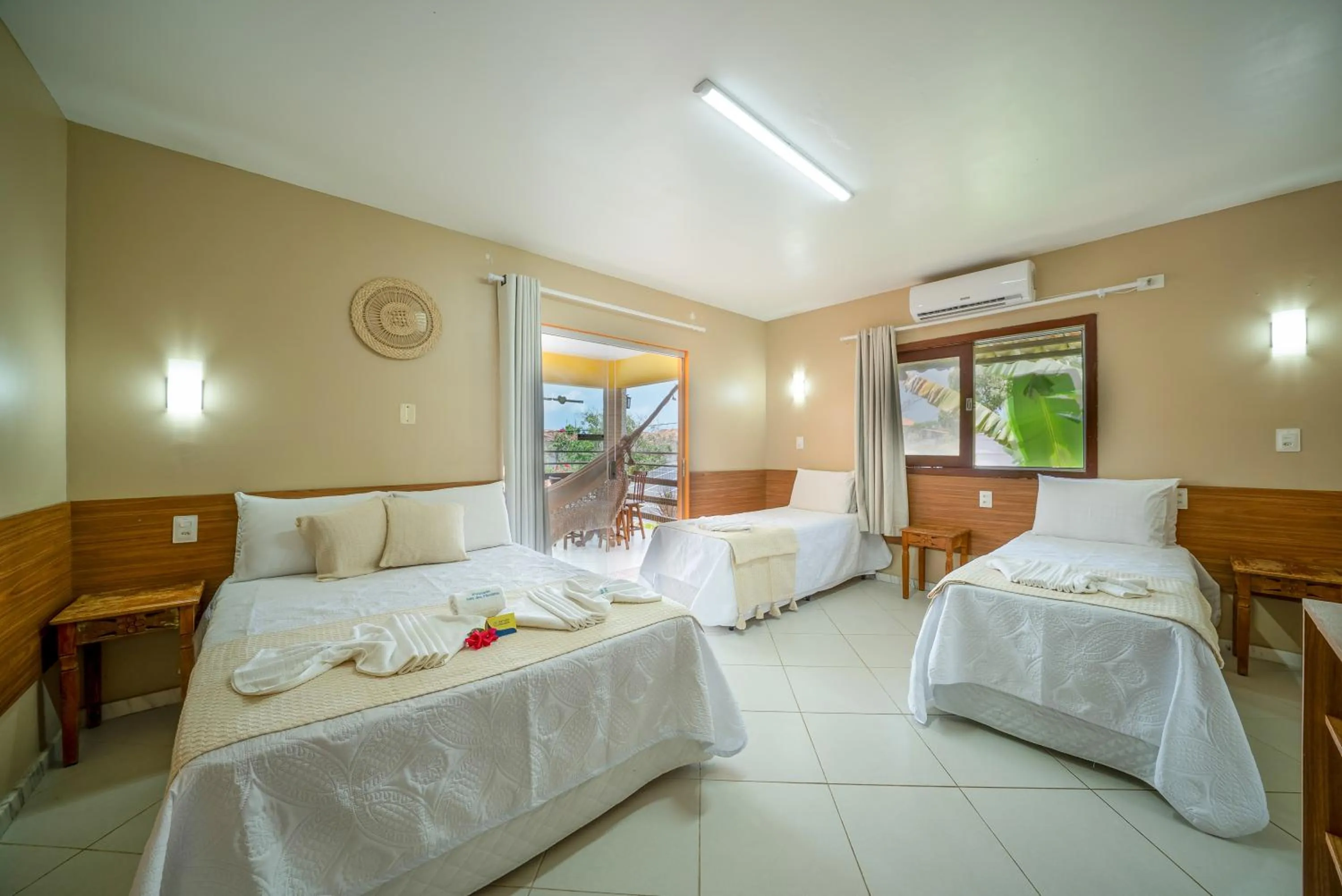 Bed in Pousada Som dos Pássaros