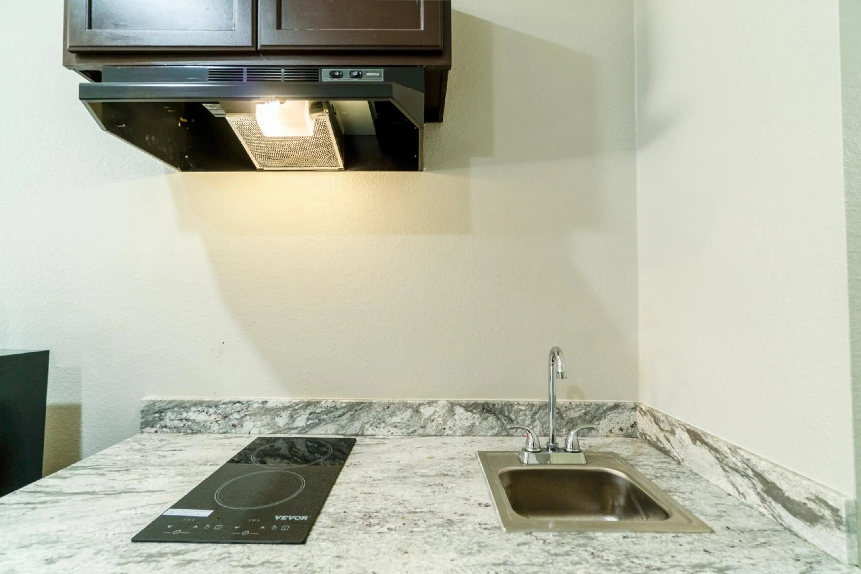 Kitchen or kitchenette in Atria Extended Stays By OYO Jourdanton