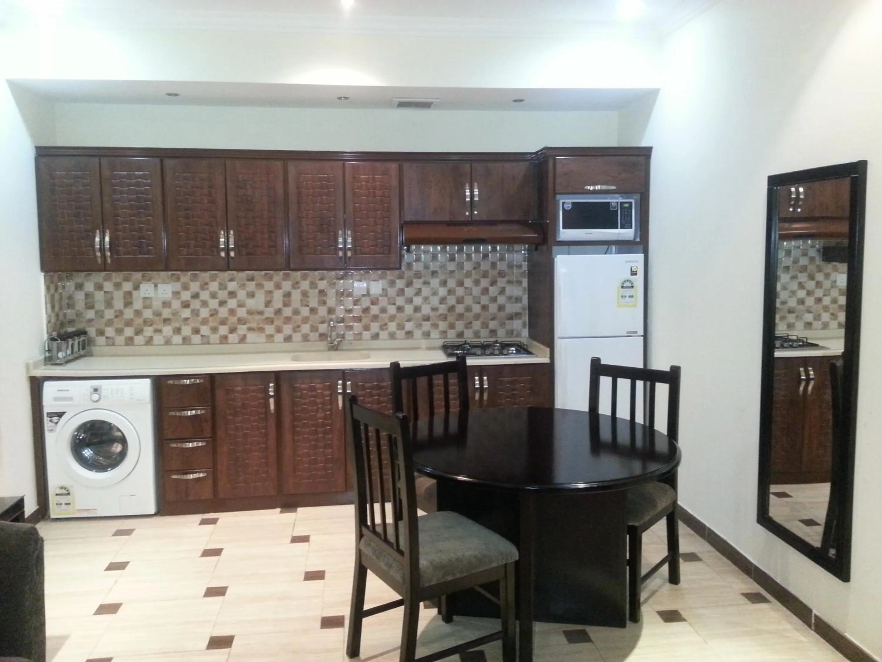 Kitchen or kitchenette in Dorar Darea Serviced Apartments - Al Malqa