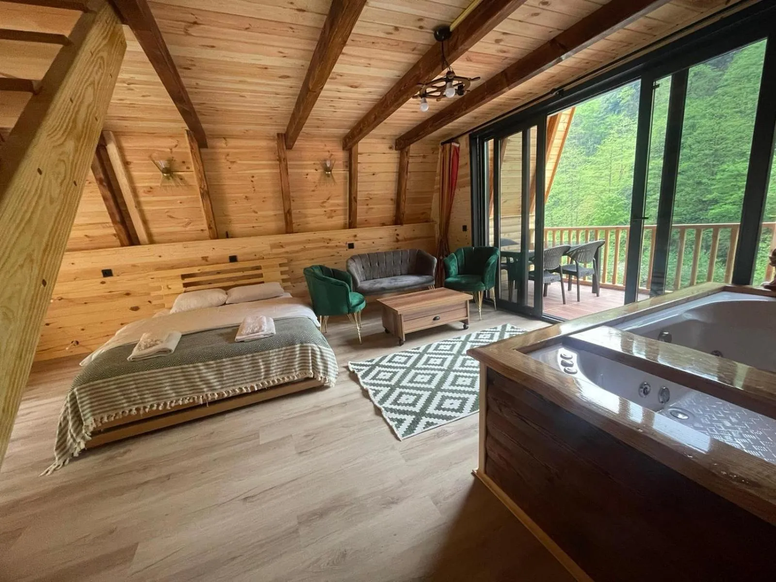 Seating area, Bed in Hayde Bungalow