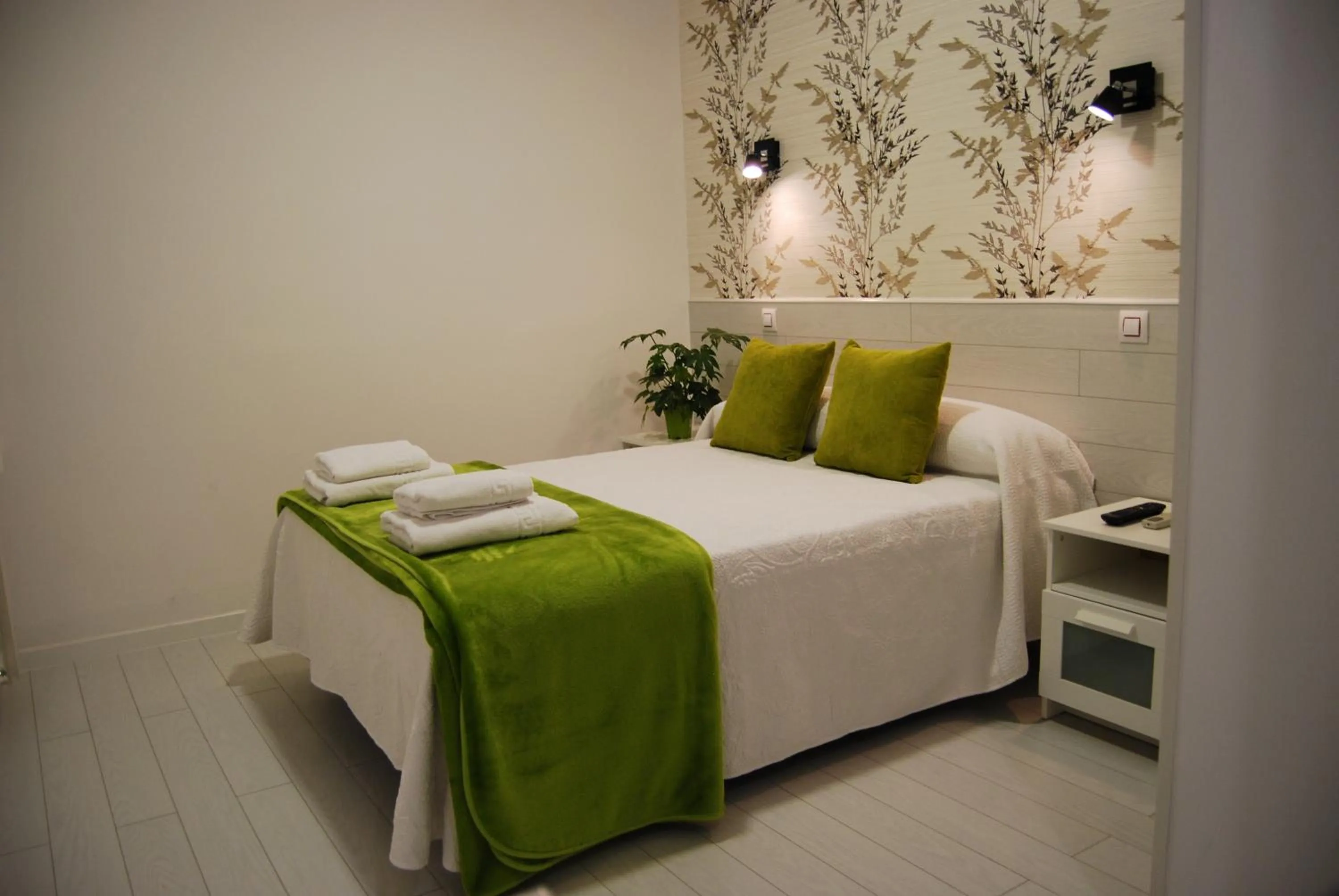 Bed in Hostal PETITE MAMAN