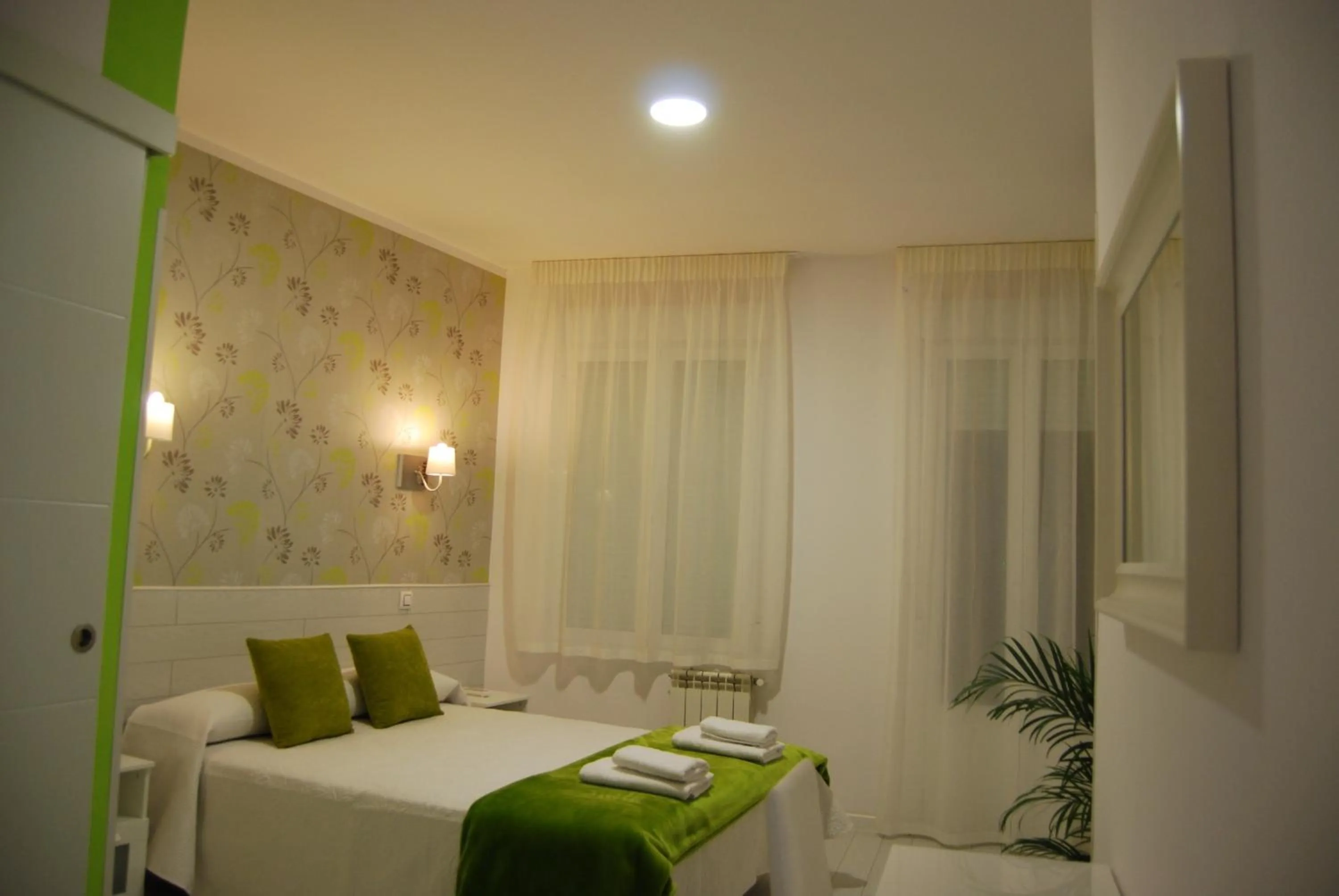 Bed in Hostal PETITE MAMAN