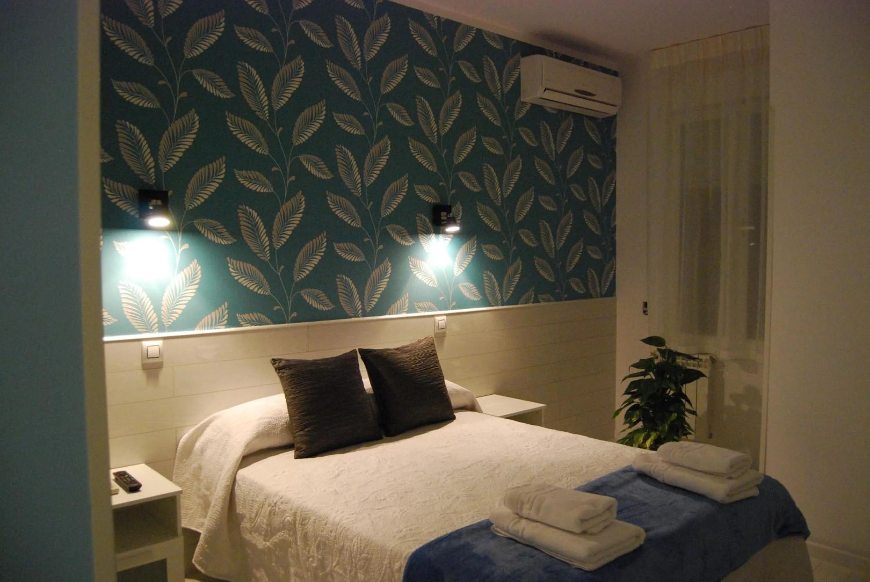 Bed in Hostal PETITE MAMAN