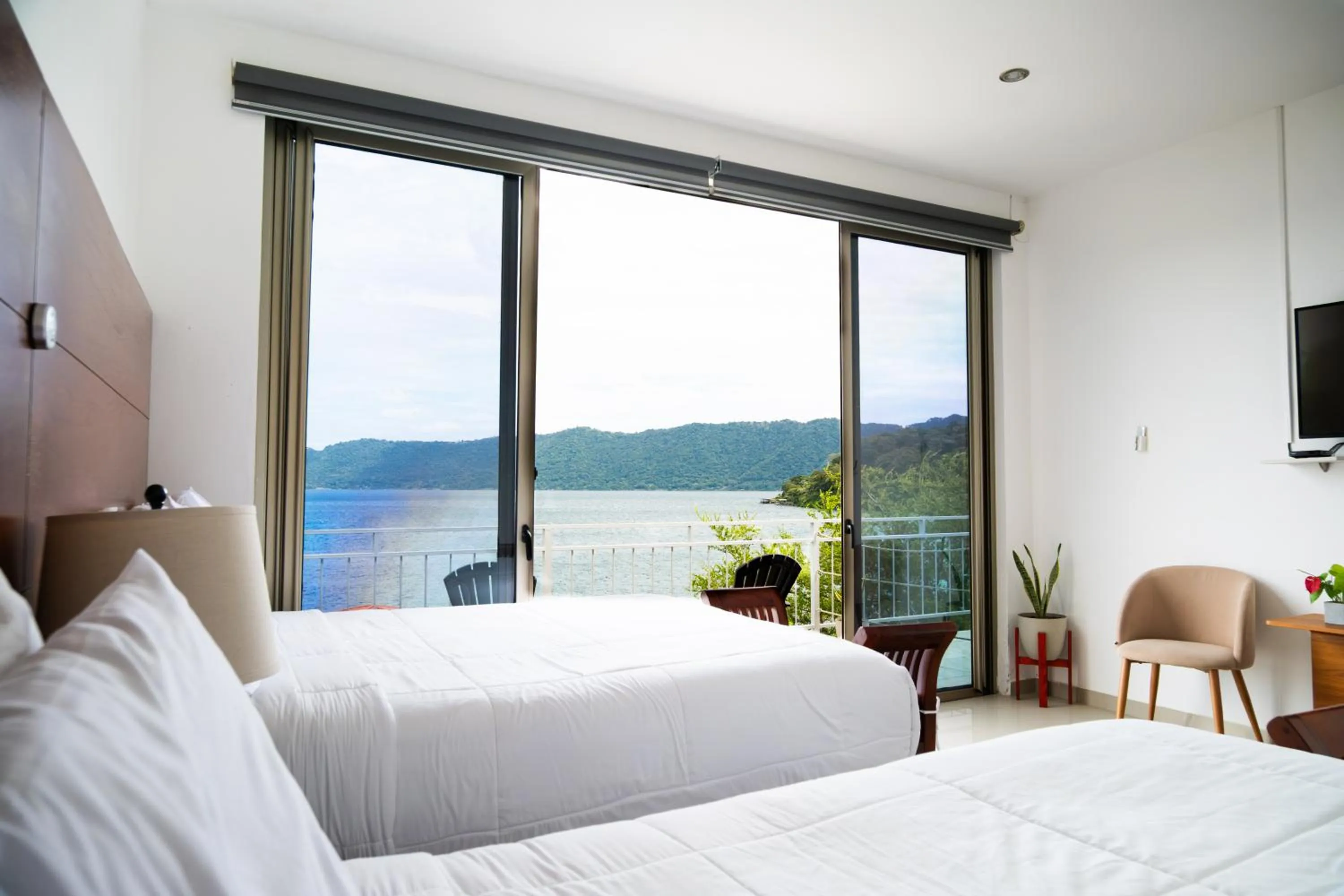 Bed in Equinoccio Hotel