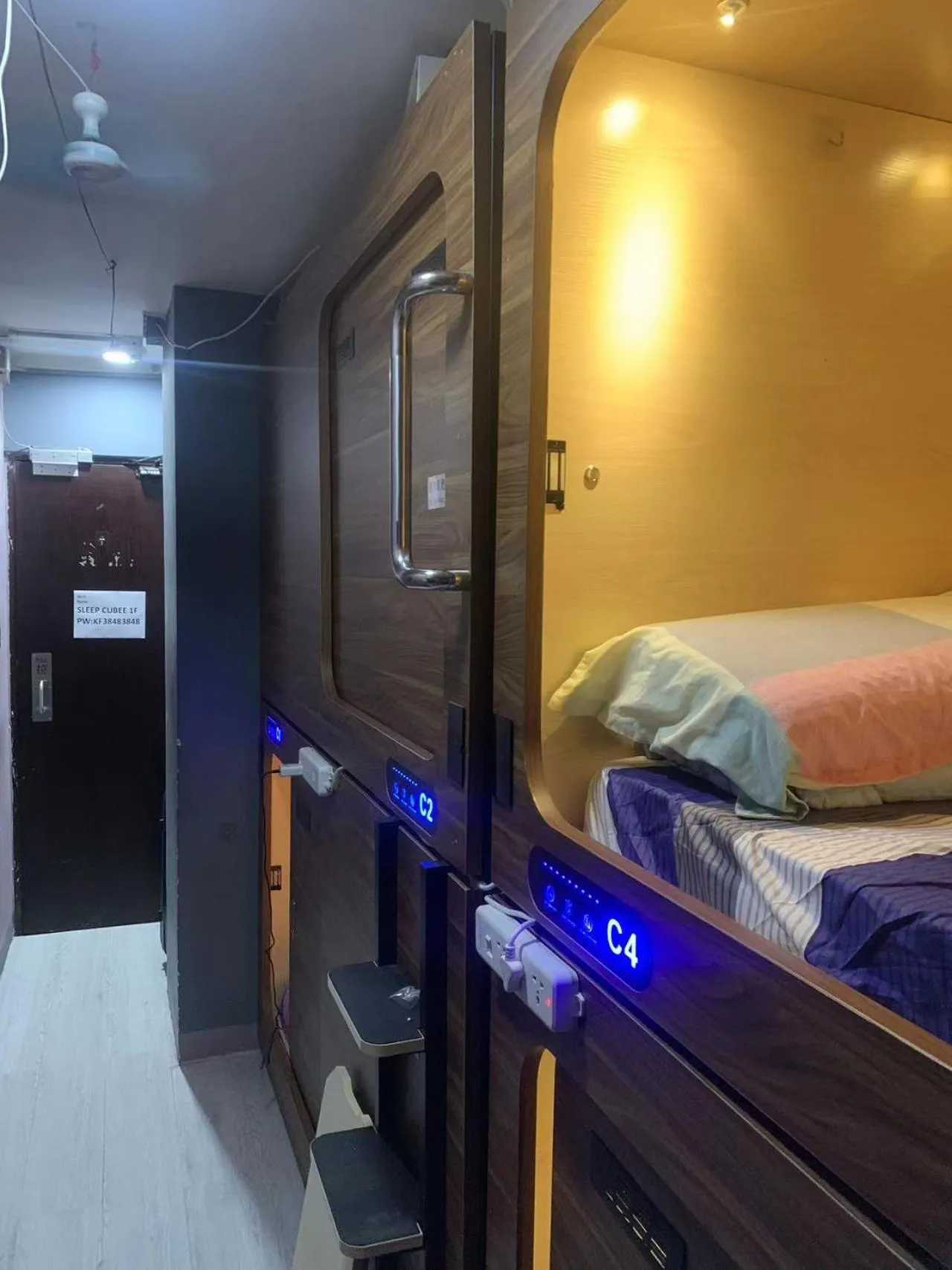 Seating area, Bed in Sleep Cubee Hostel