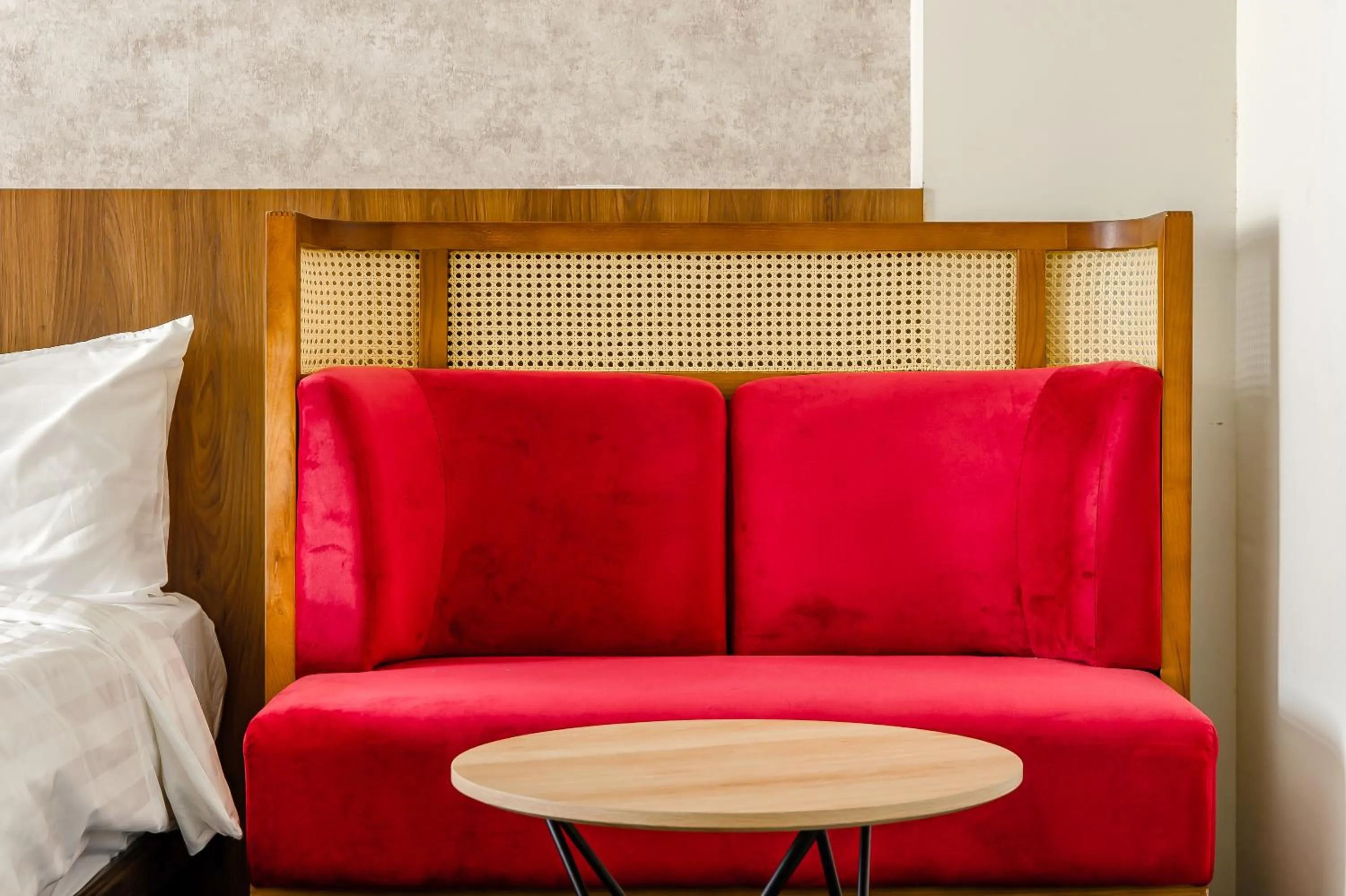 Seating area, Bed in Choco Style Inn